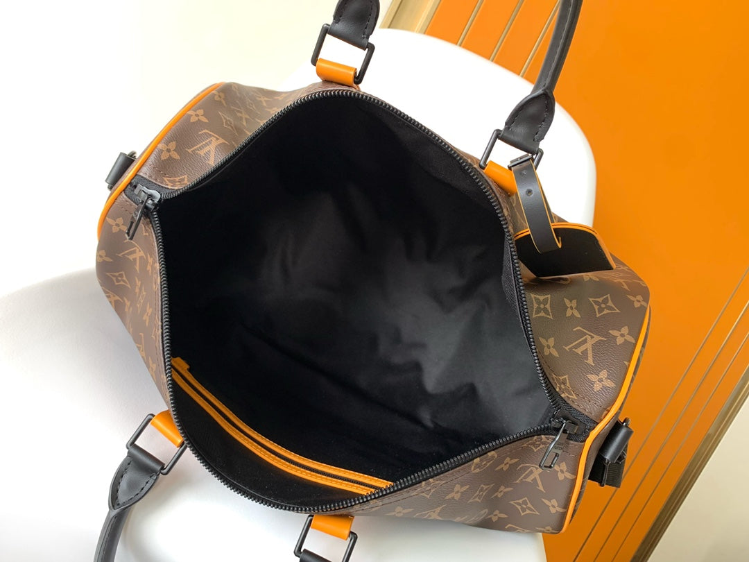 Louis Vuitton Keepall Bandoulière 50 Monogram Macassar with Orange Trim