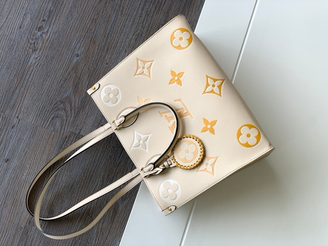 Louis Vuitton OnTheGo MM Monogram Empreinte Leather Tote Bag - Cream/Yellow