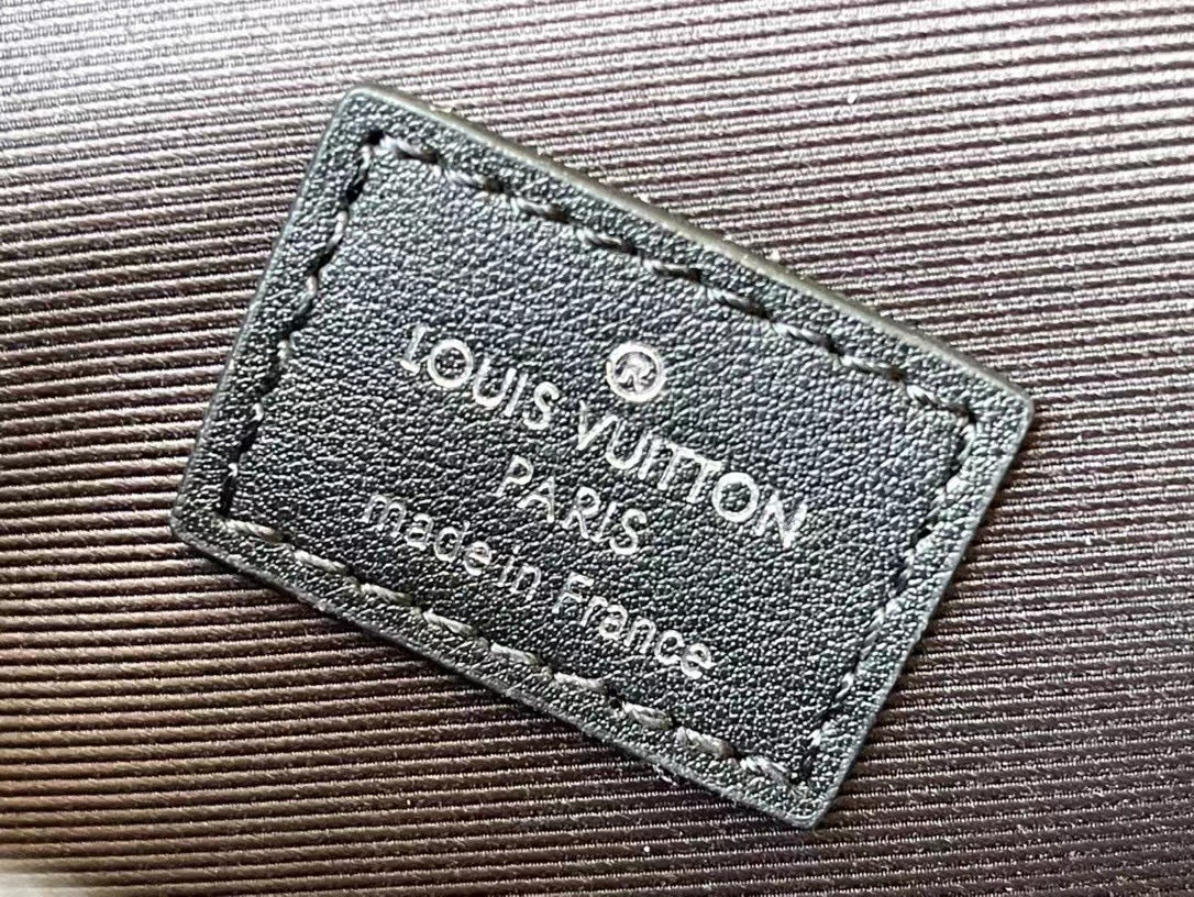 Louis Vuitton Matte Black Embossed Leather Crossbody Bag with Chain Detail