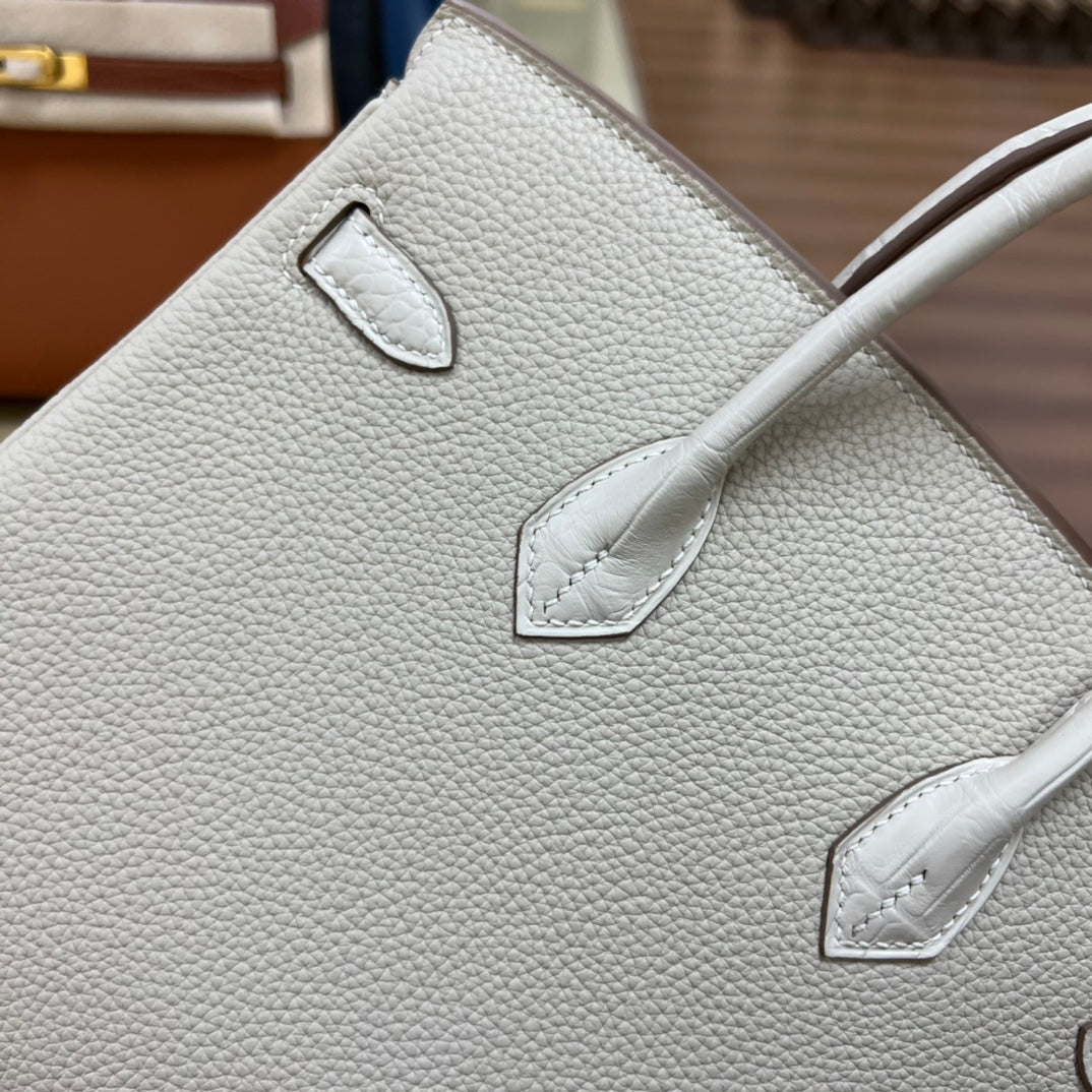 Luxury White Leather Top Handle Handbag with Gold Clasp Detail