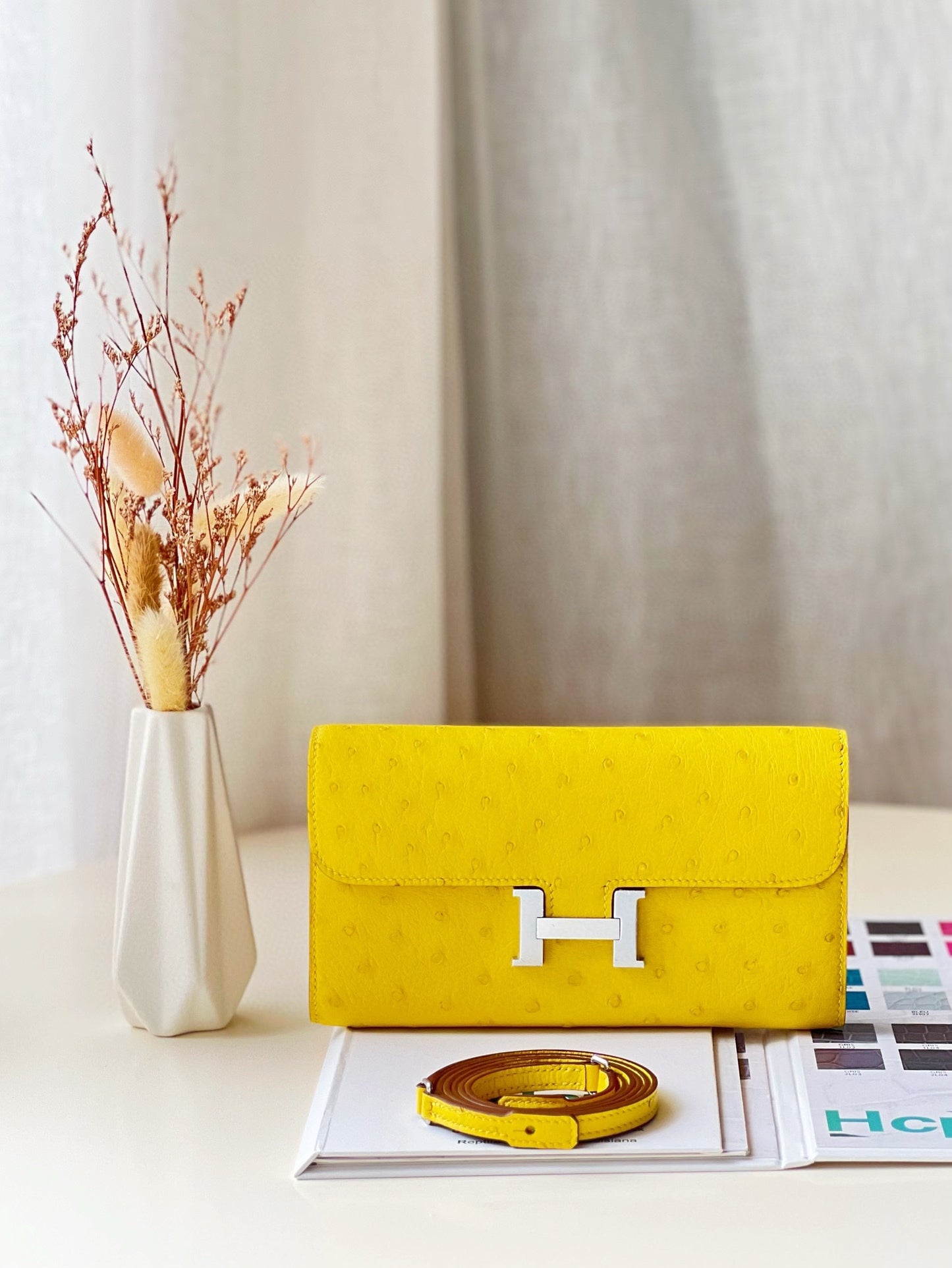 Elegant Cream Leather Crossbody Bag with Gold H-Logo Clasp