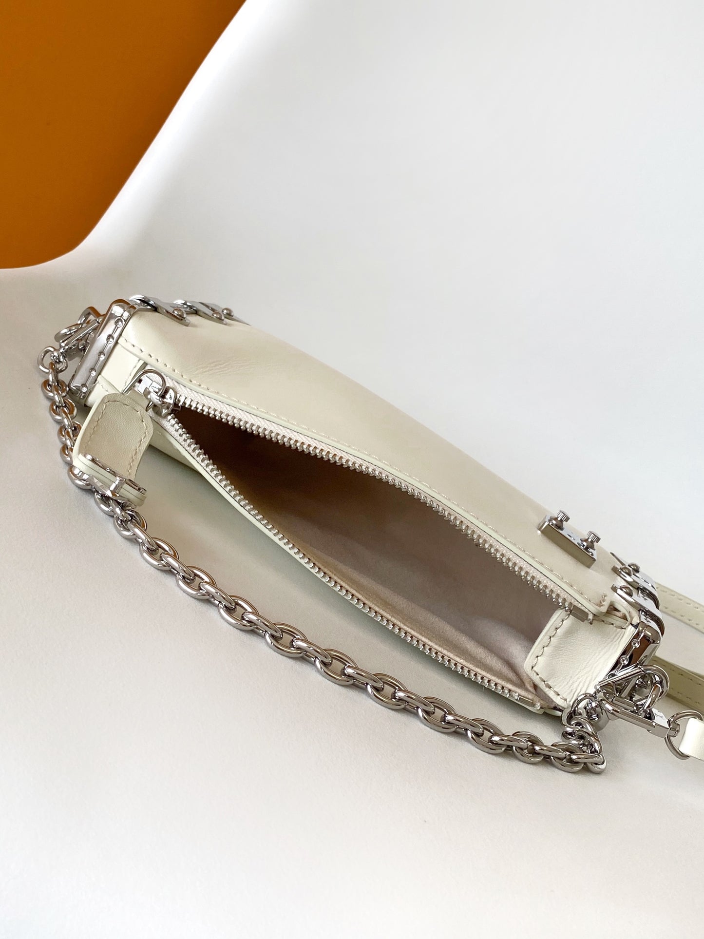 Louis Vuitton Beige Leather Crossbody Bag with Silver Studded Corners and Chain Strap