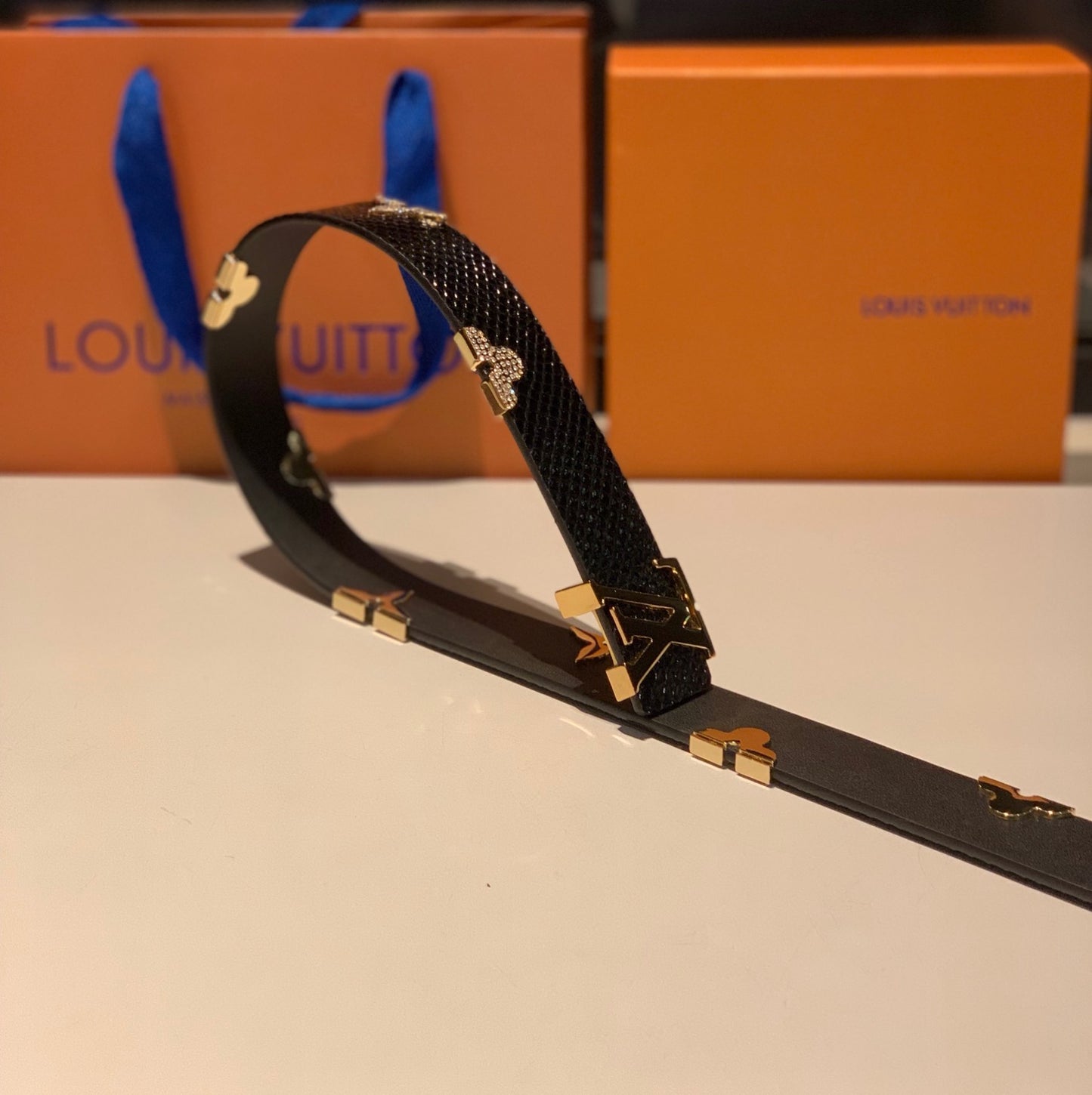 Luxury Designer Black Textured Leather Belt with Gold LV Initial Buckle and Floral Monogram Embellishments