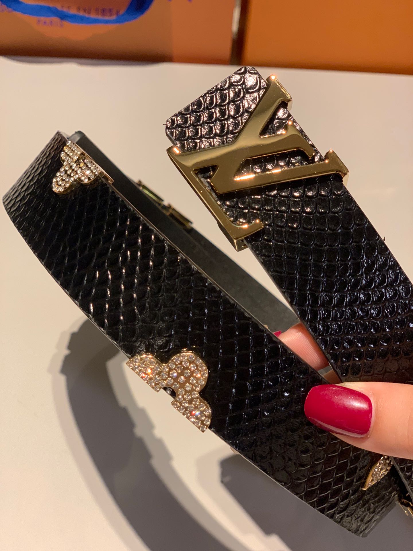 Luxury Designer Black Textured Leather Belt with Gold LV Initial Buckle and Floral Monogram Embellishments