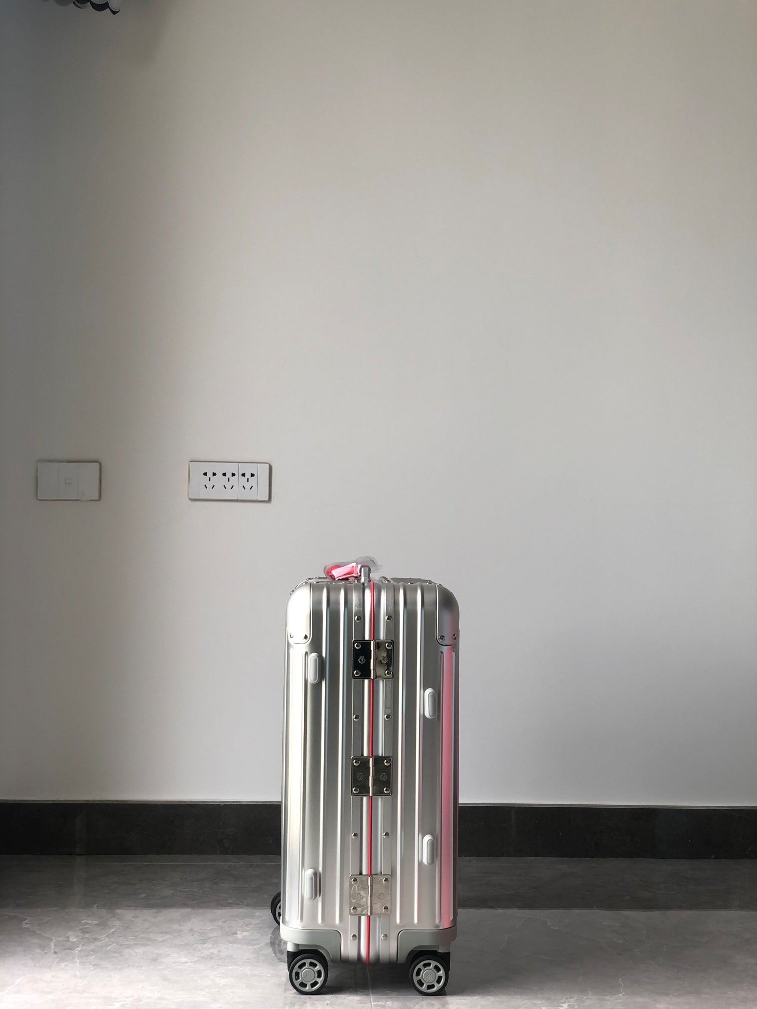 Silver Metallic Hardside Spinner Suitcase with Pink Accent