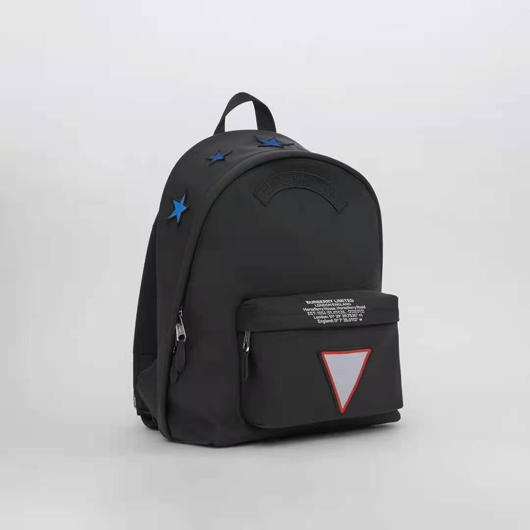 Black Urban Backpack with Star Accents and Geometric Logo