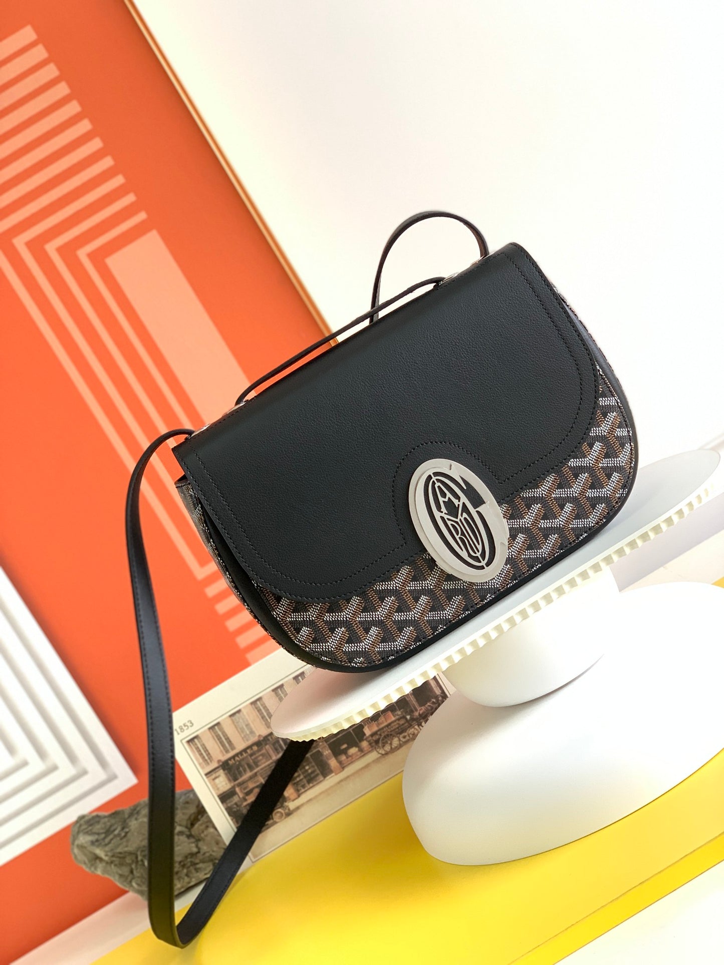 Gogy Black Leather Crossbody Bag with Chevron Monogram Print and Oval Clasp