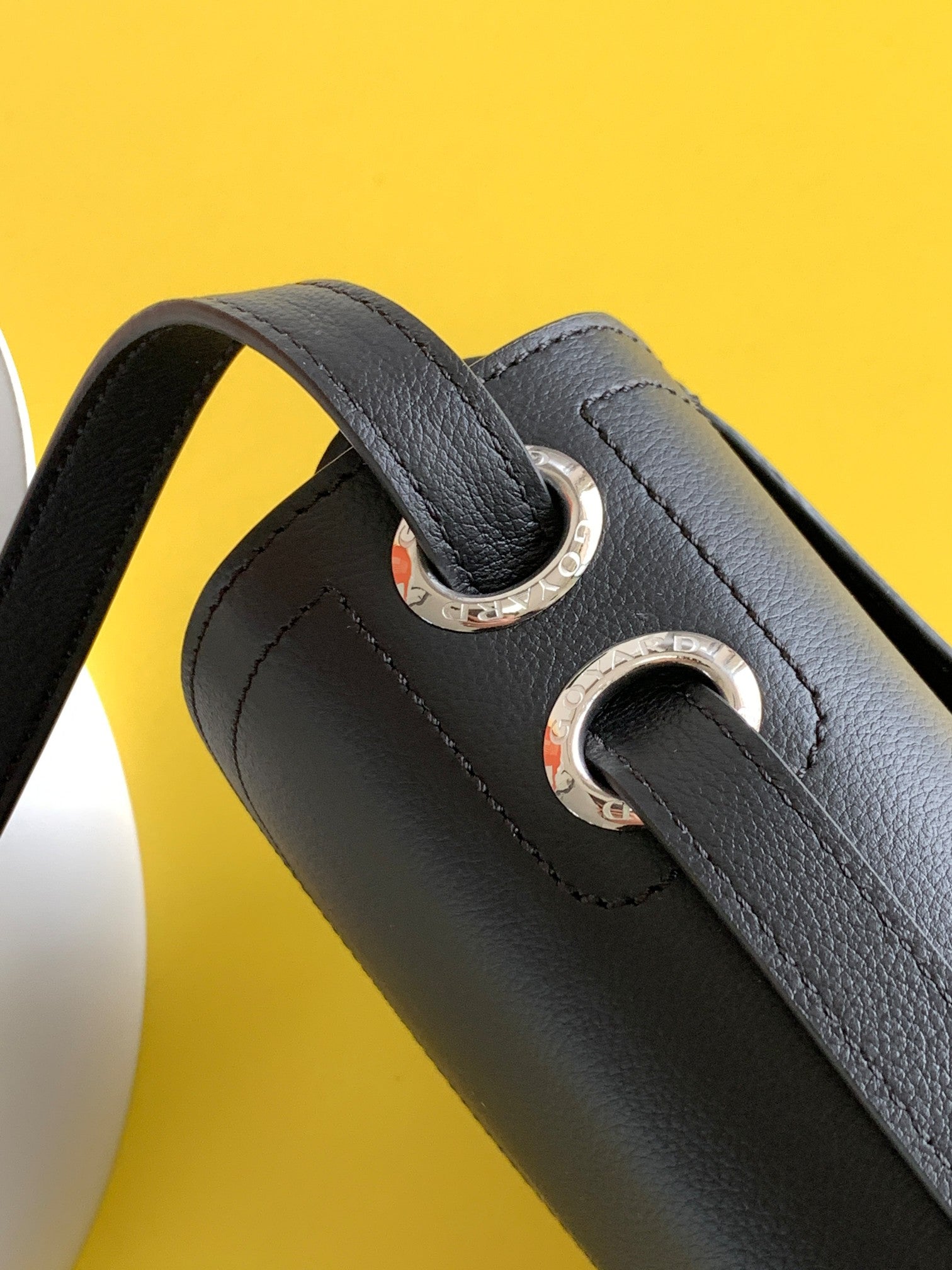 Gogy Black Leather Crossbody Bag with Chevron Monogram Print and Oval Clasp