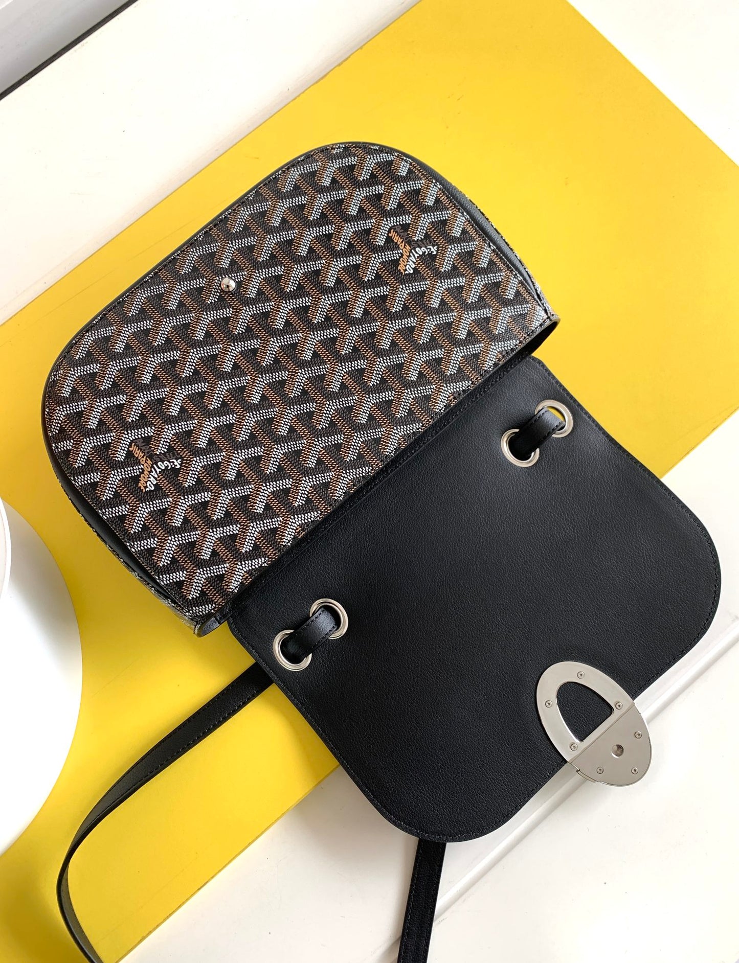 Gogy Black Leather Crossbody Bag with Chevron Monogram Print and Oval Clasp