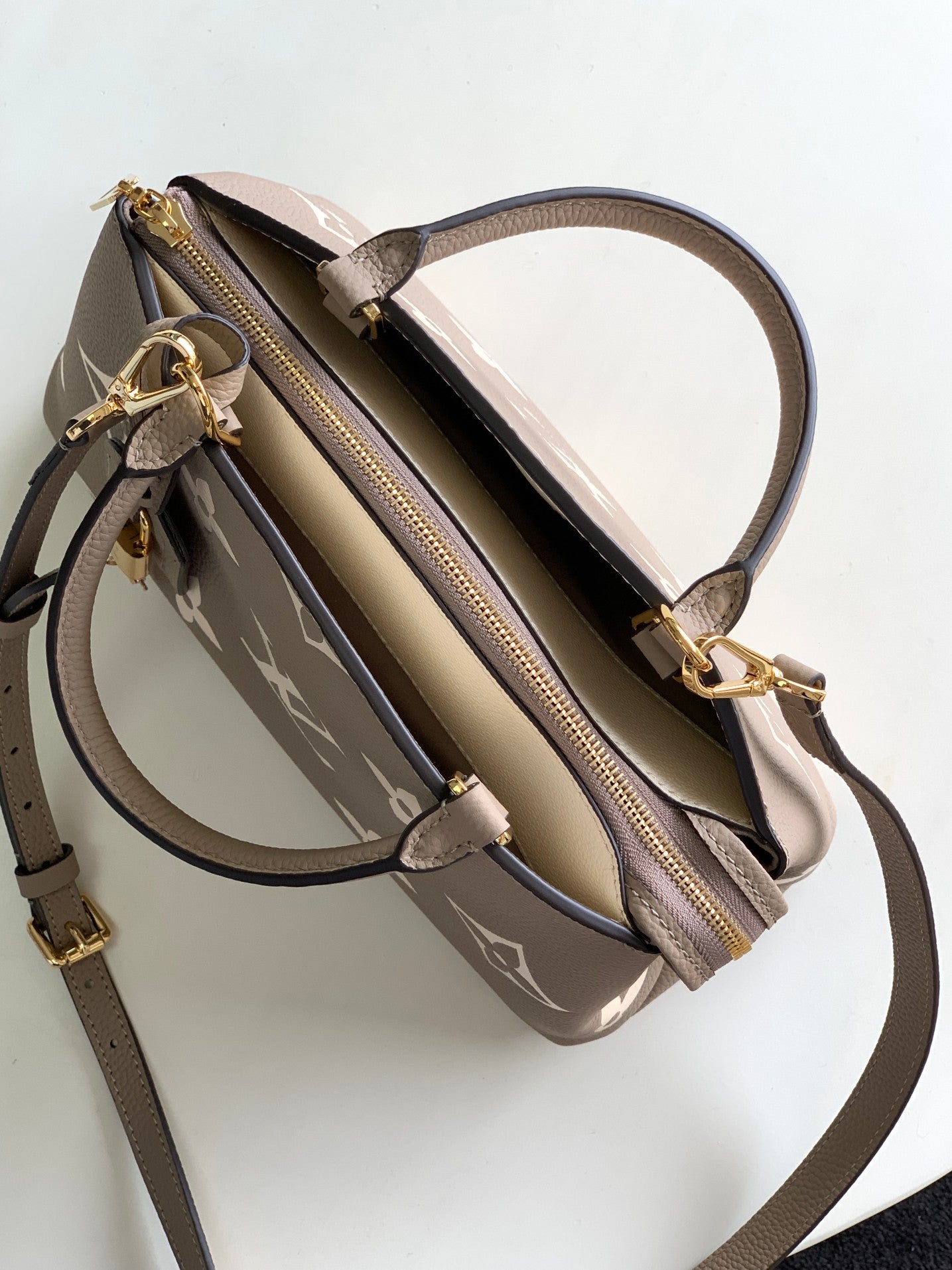 Louis Vuitton Rivoli PM Monogram Empreinte Leather Bag - Turtledove