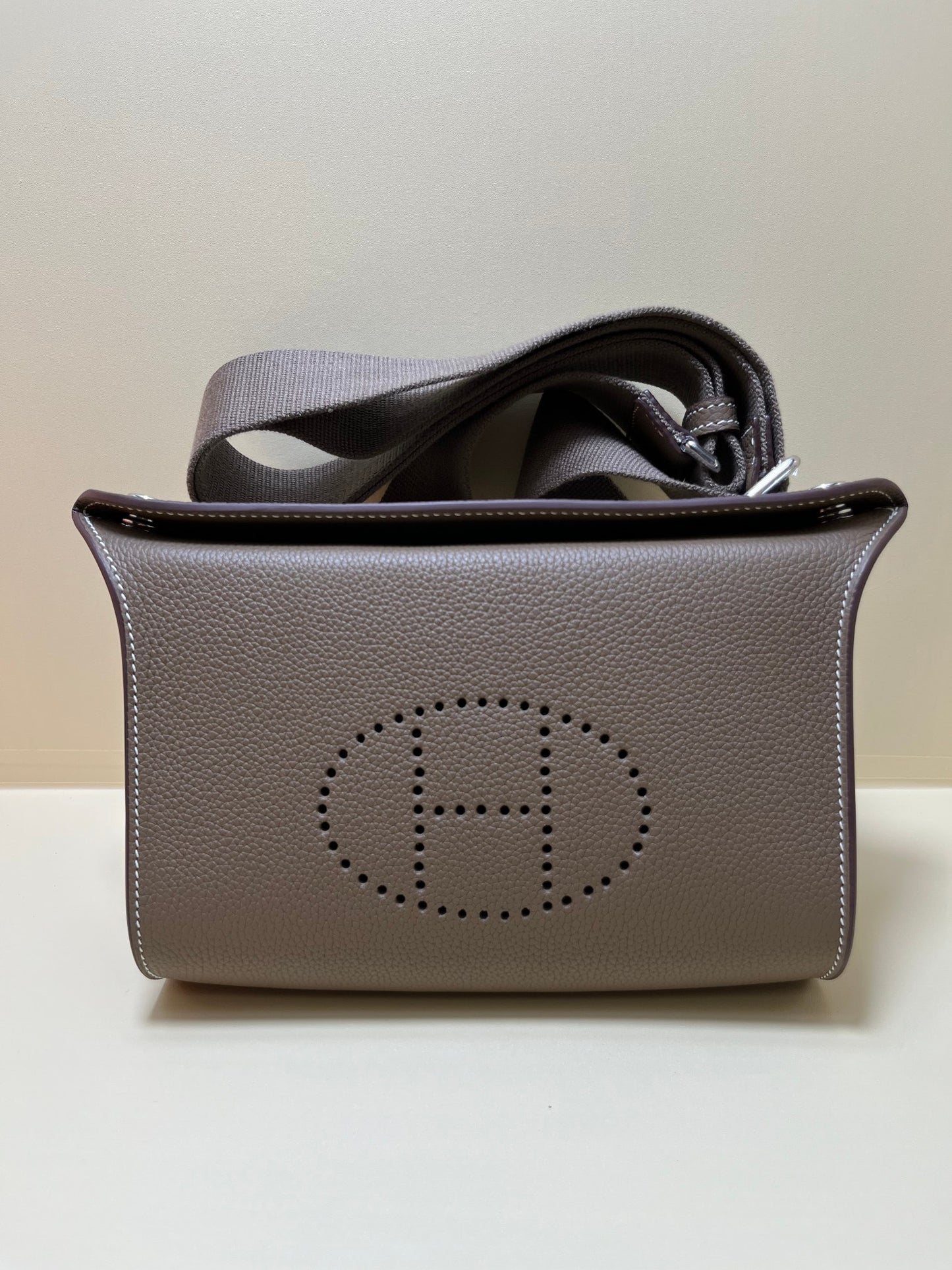 Luxury Pebbled Leather Crossbody Bag with Perforated H Logo - Taupe