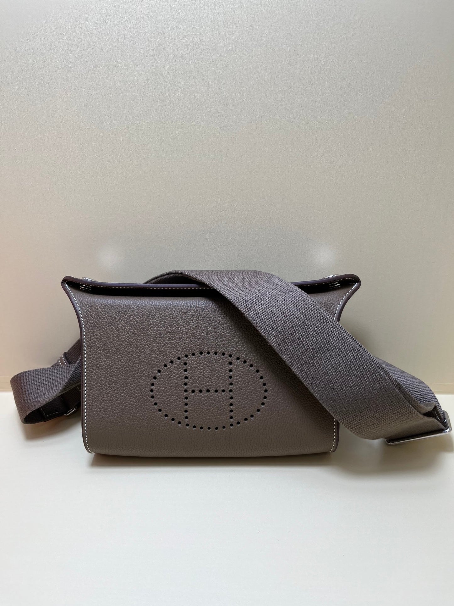 Luxury Pebbled Leather Crossbody Bag with Perforated H Logo - Taupe