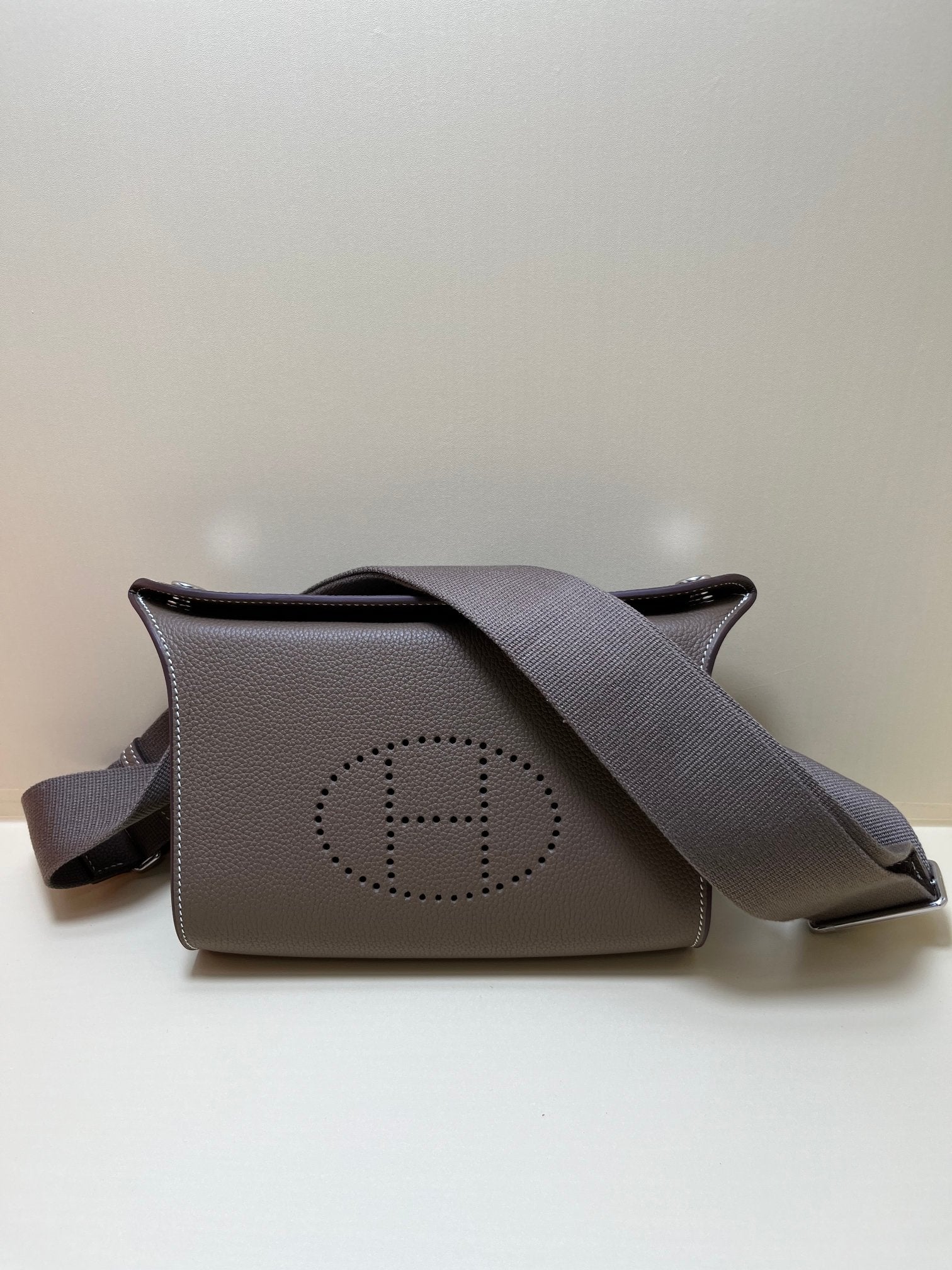 Luxury Pebbled Leather Crossbody Bag with Perforated H Logo - Taupe