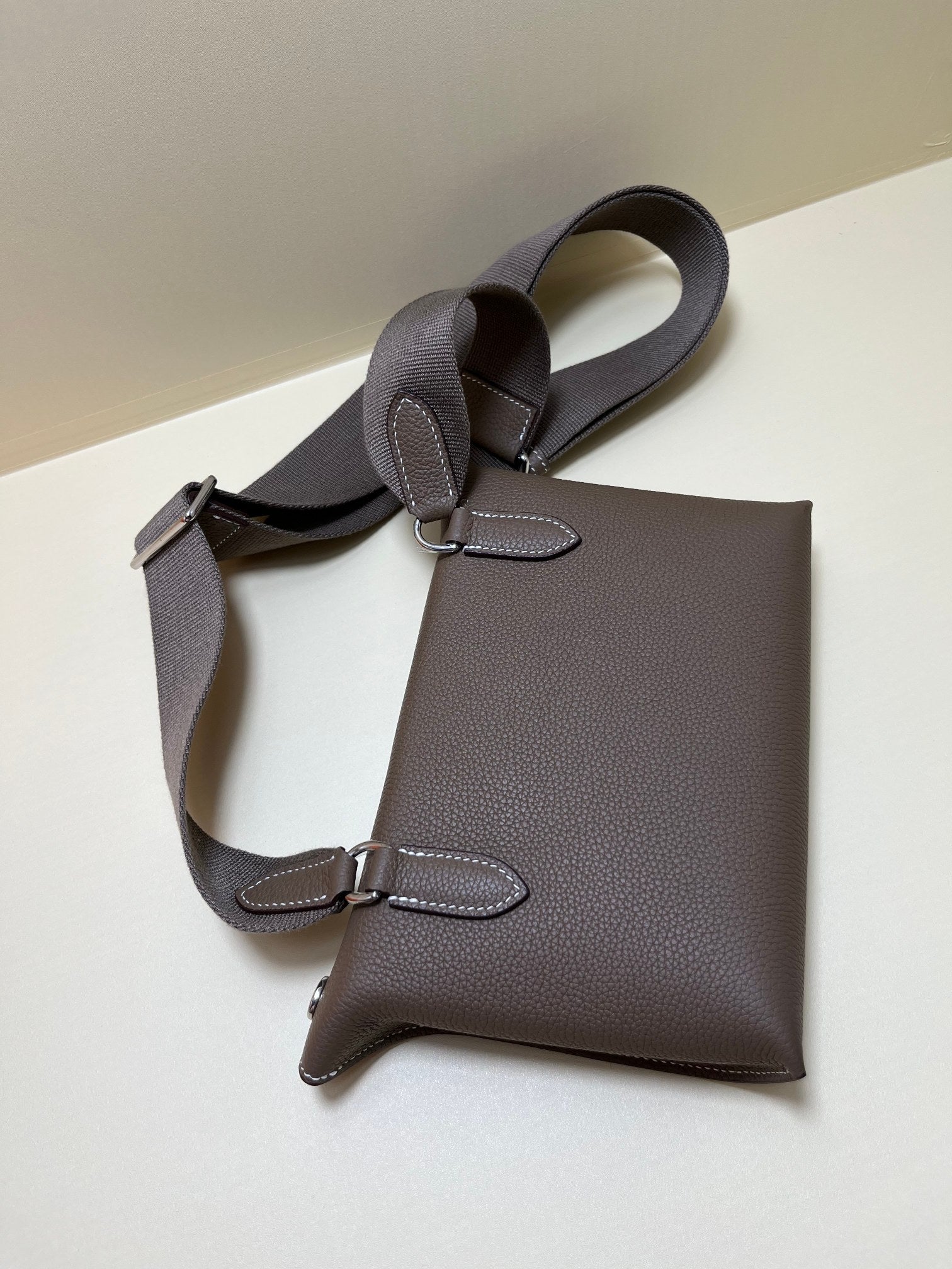 Luxury Pebbled Leather Crossbody Bag with Perforated H Logo - Taupe