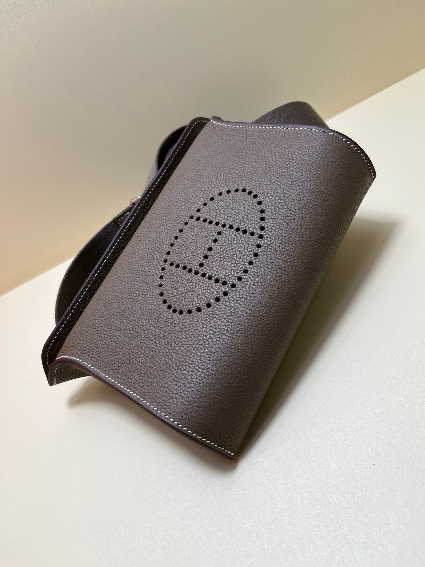 Luxury Pebbled Leather Crossbody Bag with Perforated H Logo - Taupe