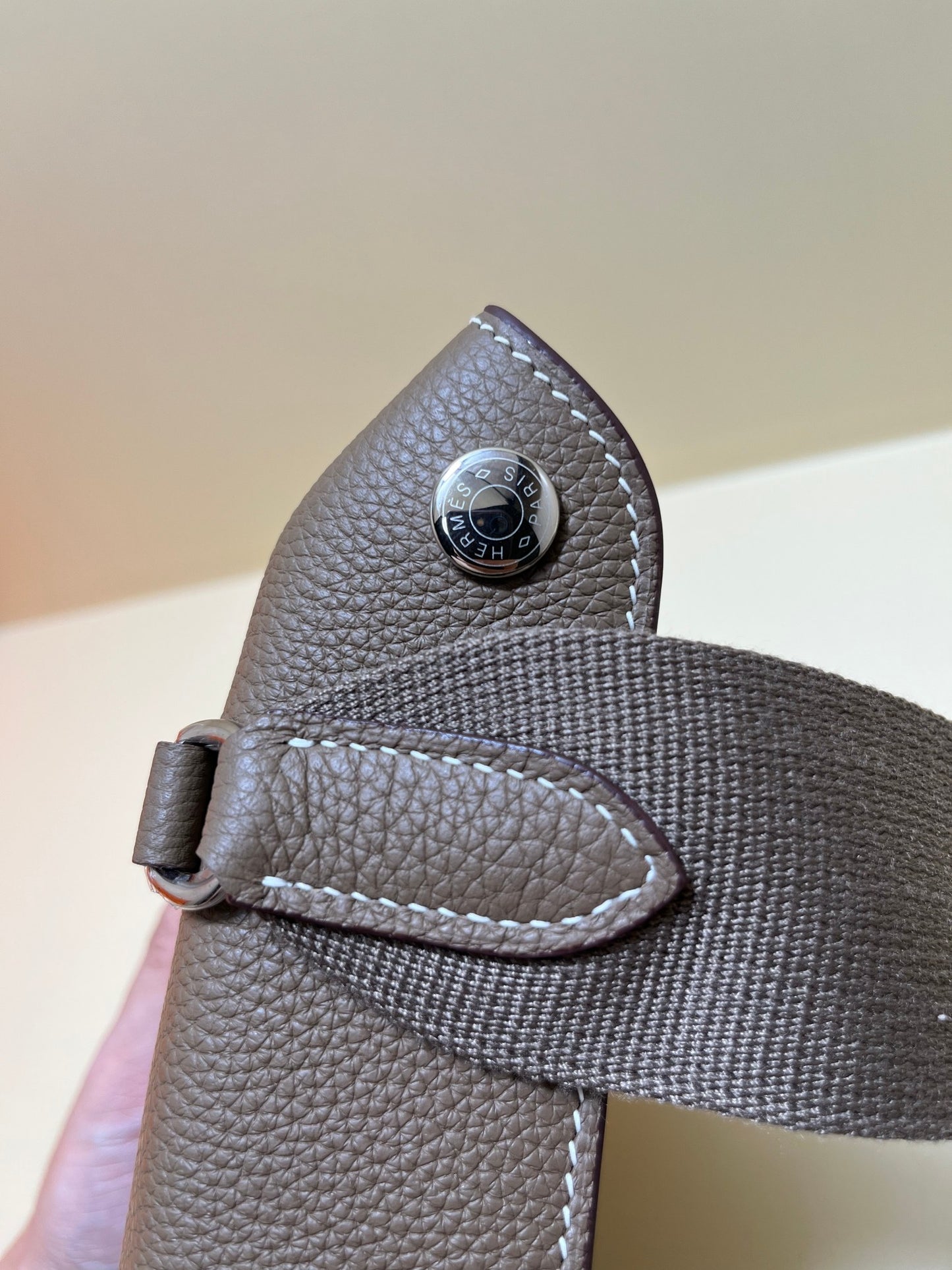 Luxury Pebbled Leather Crossbody Bag with Perforated H Logo - Taupe