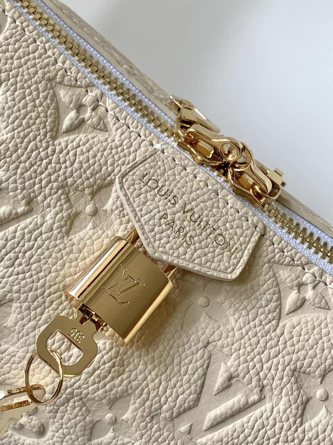 Louis Vuitton Bagatelle Monogram Empreinte Leather Shoulder Bag - Cream