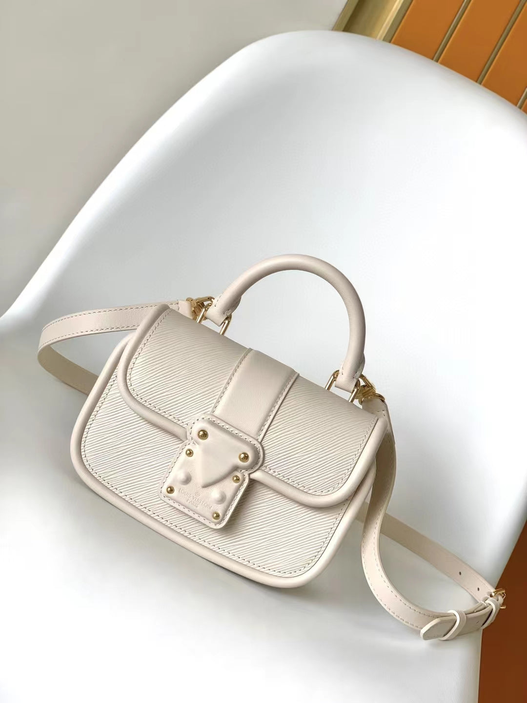 Elegant Beige Leather Micro Top Handle Bag with Gold Hardware