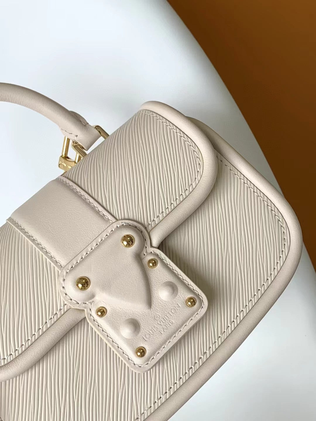 Elegant Beige Leather Micro Top Handle Bag with Gold Hardware