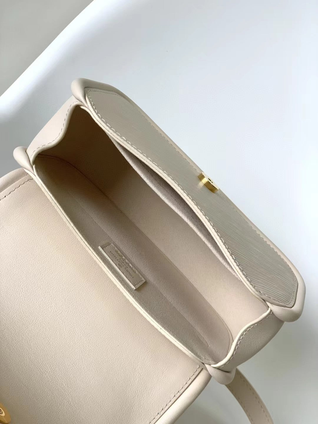 Elegant Beige Leather Micro Top Handle Bag with Gold Hardware