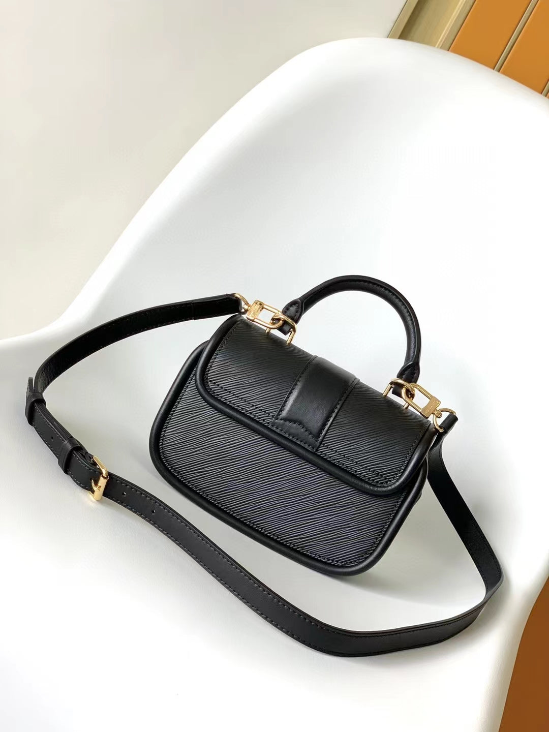 Elegant Black Leather Mini Top-Handle Handbag with Gold-Tone Hardware