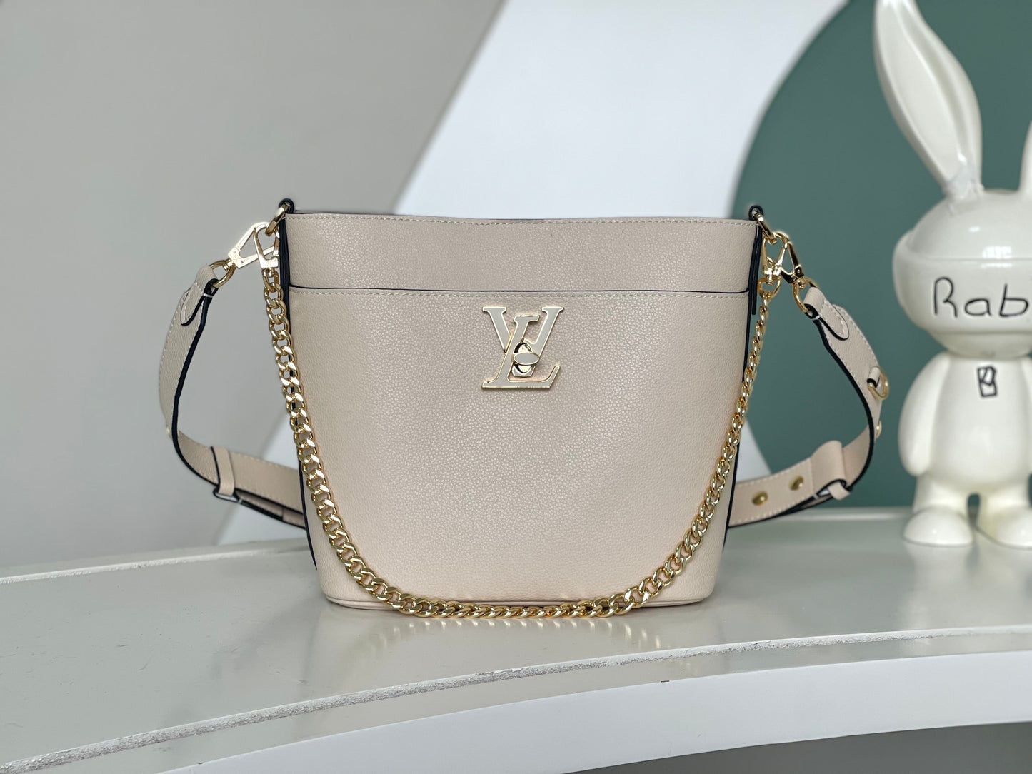 Louis Vuitton Lockme Bucket Bag in Cream Grained Leather with Gold-Tone Hardware