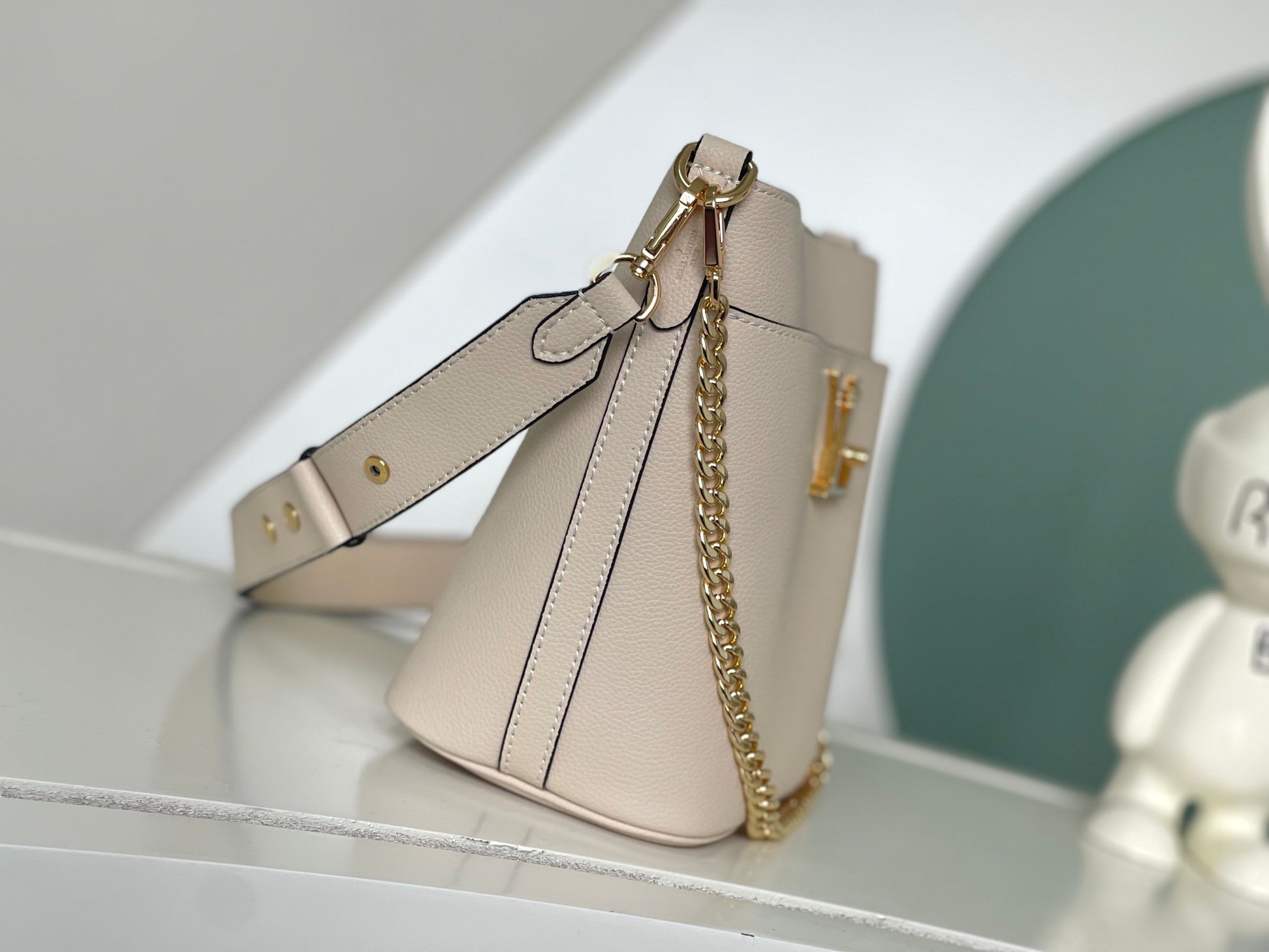 Louis Vuitton Lockme Bucket Bag in Cream Grained Leather with Gold-Tone Hardware