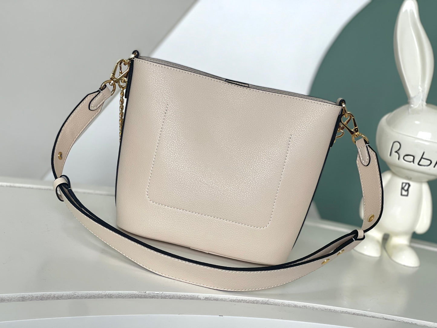 Louis Vuitton Lockme Bucket Bag in Cream Grained Leather with Gold-Tone Hardware