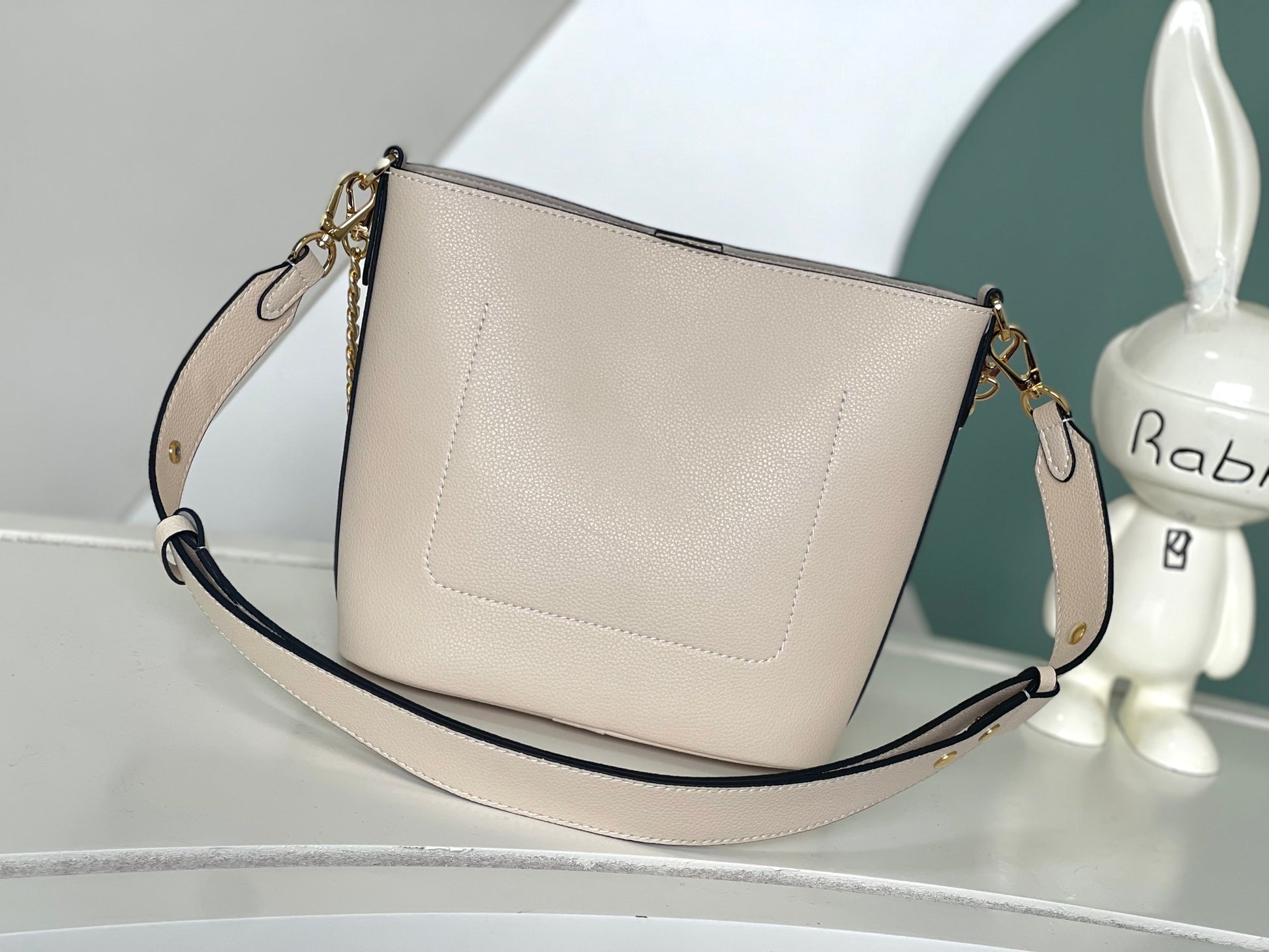 Louis Vuitton Lockme Bucket Bag in Cream Grained Leather with Gold-Tone Hardware