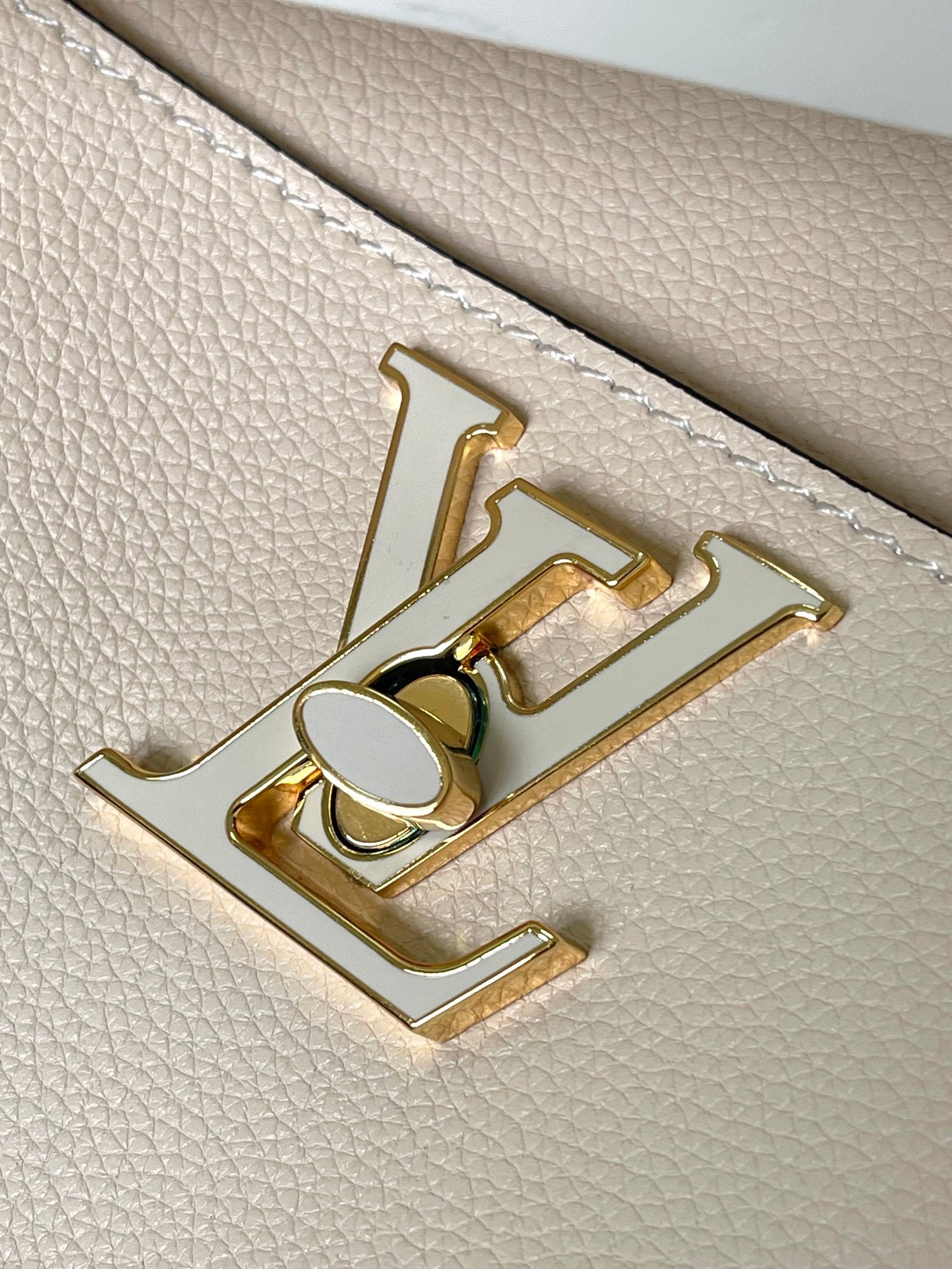 Louis Vuitton Lockme Bucket Bag in Cream Grained Leather with Gold-Tone Hardware