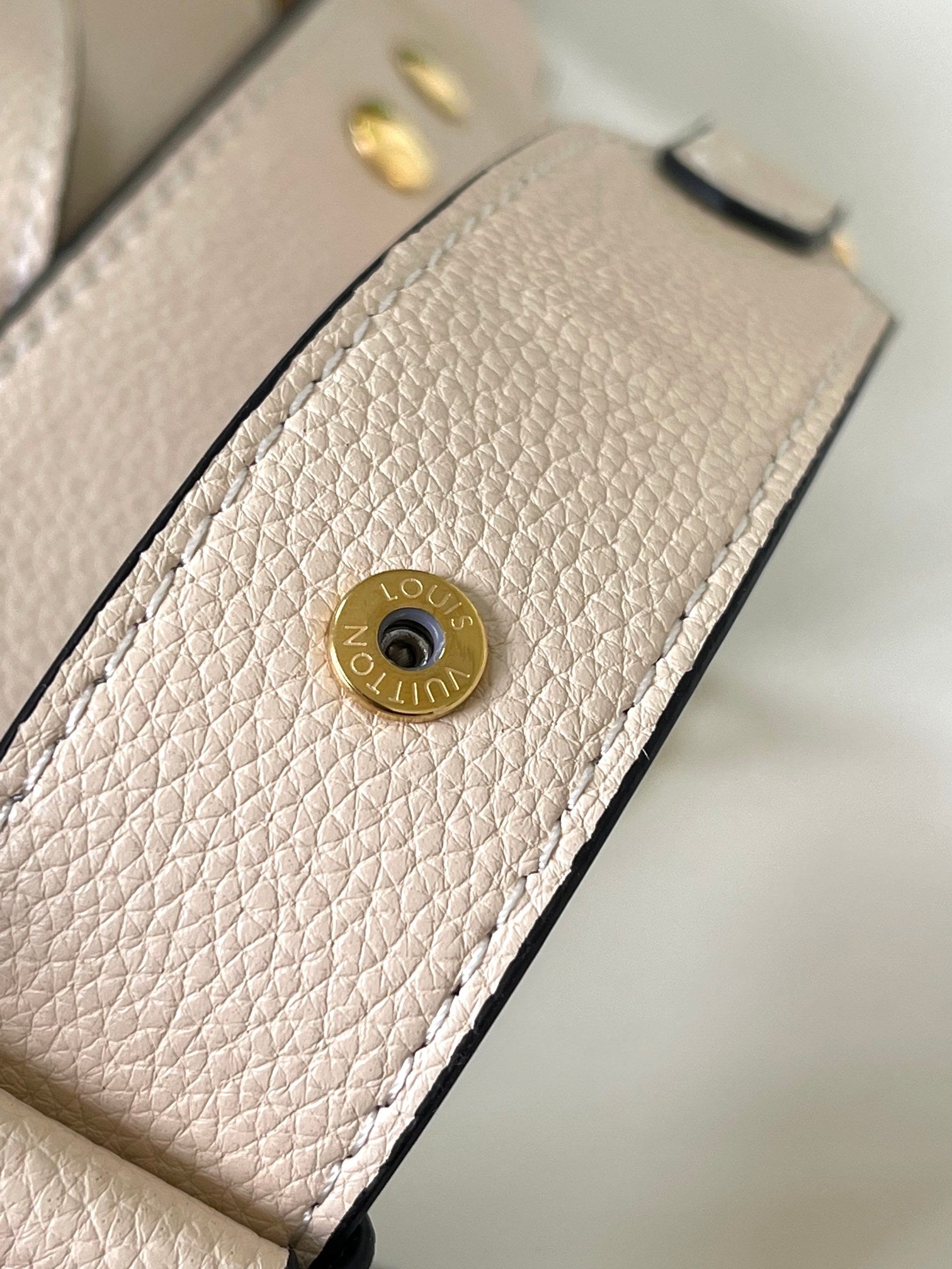 Louis Vuitton Lockme Bucket Bag in Cream Grained Leather with Gold-Tone Hardware