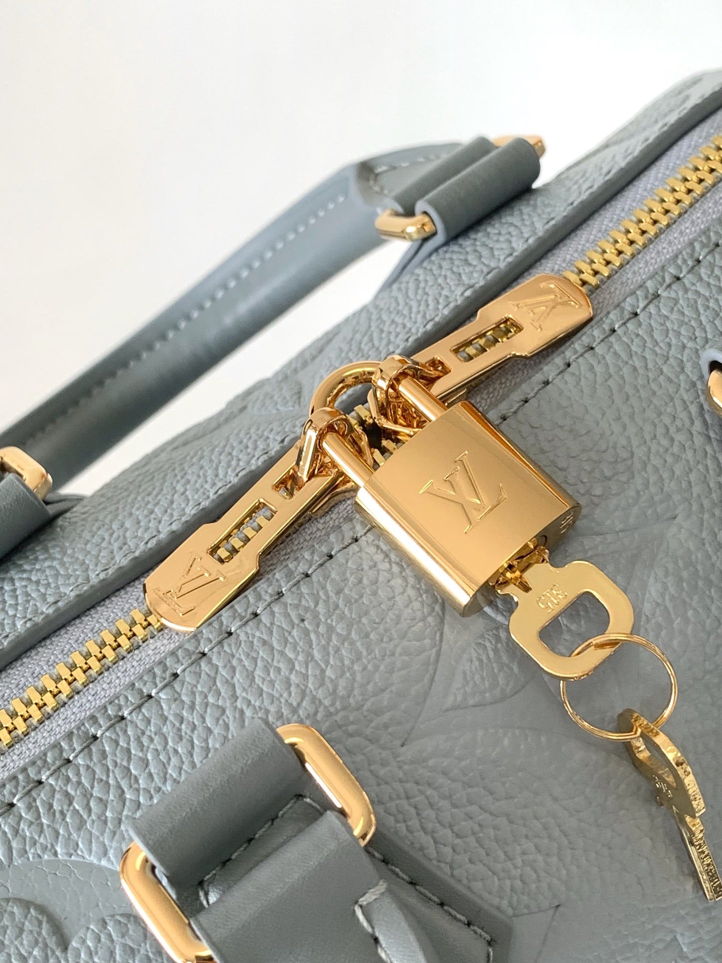 Louis Vuitton Monogram Empreinte Speedy Bandoulière 20 Handbag - Light Blue