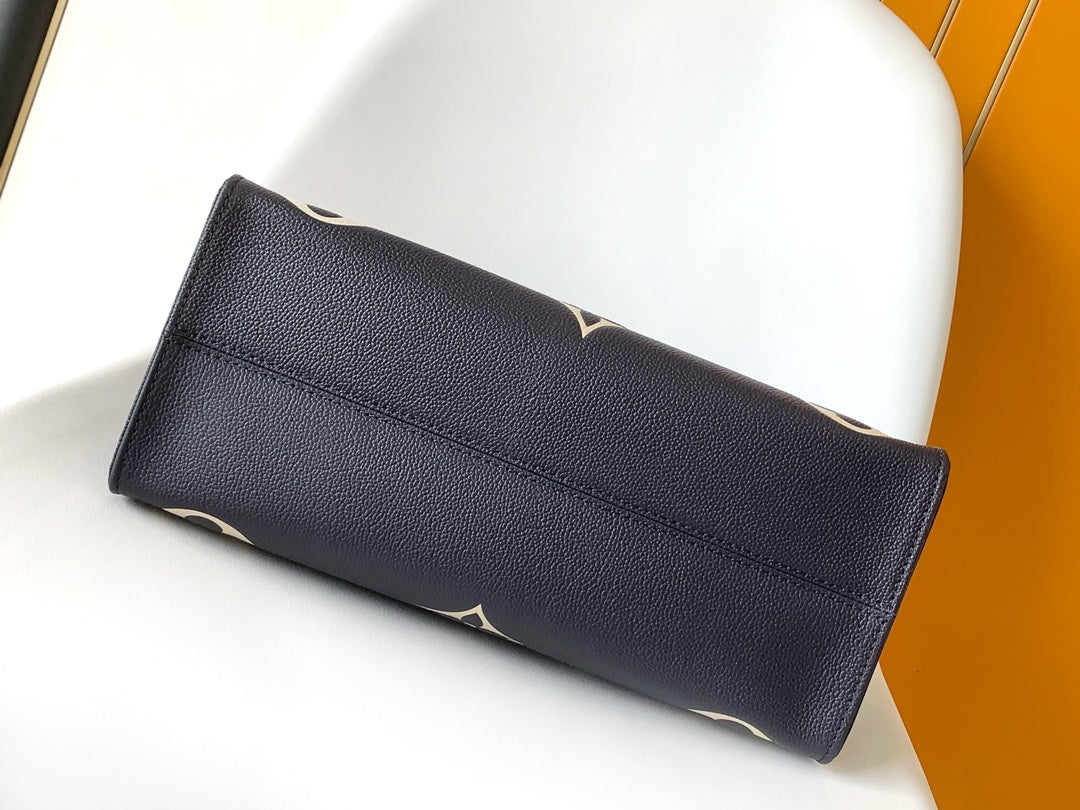 Louis Vuitton OnTheGo MM Monogram Empreinte Navy Blue Leather Tote Bag