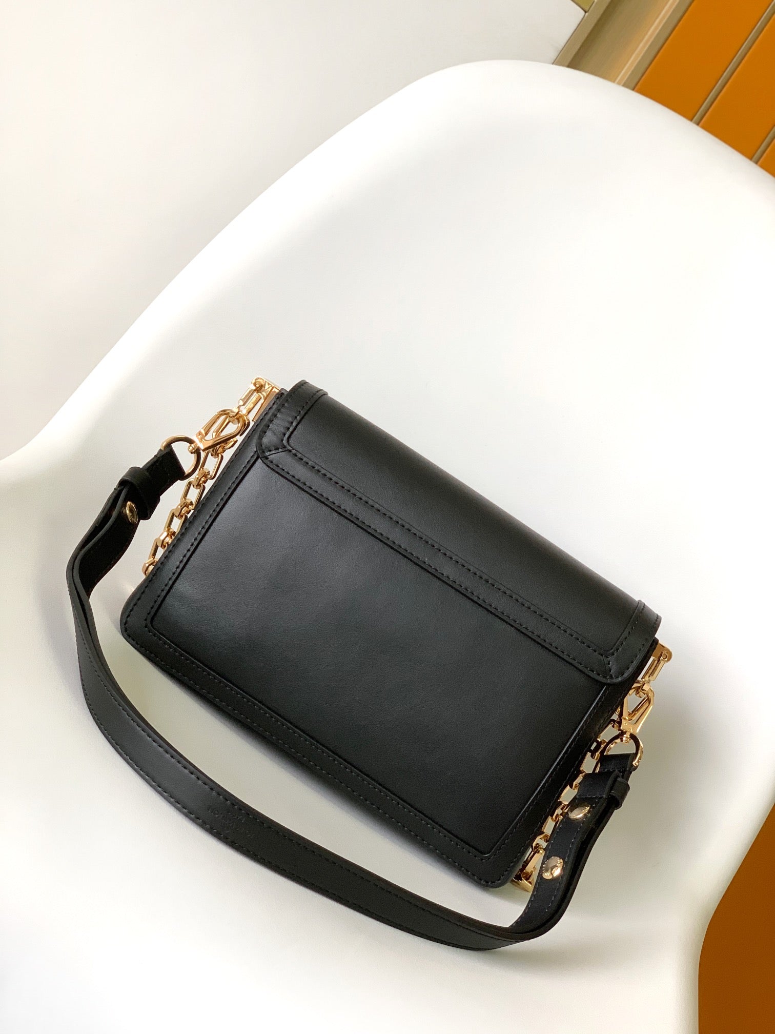 Women's Elegant Black Faux Leather Crossbody Bag with Gold Chain Detail