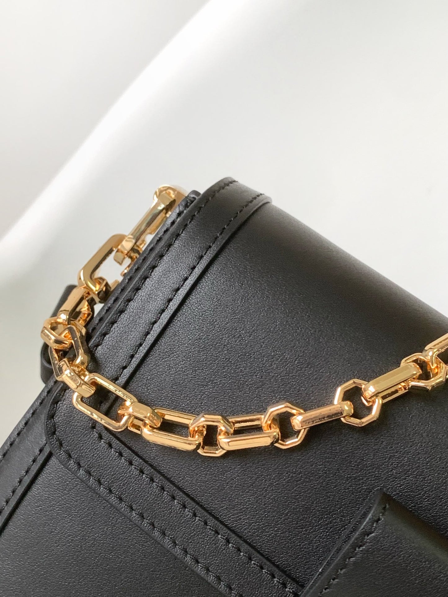 Women's Elegant Black Faux Leather Crossbody Bag with Gold Chain Detail