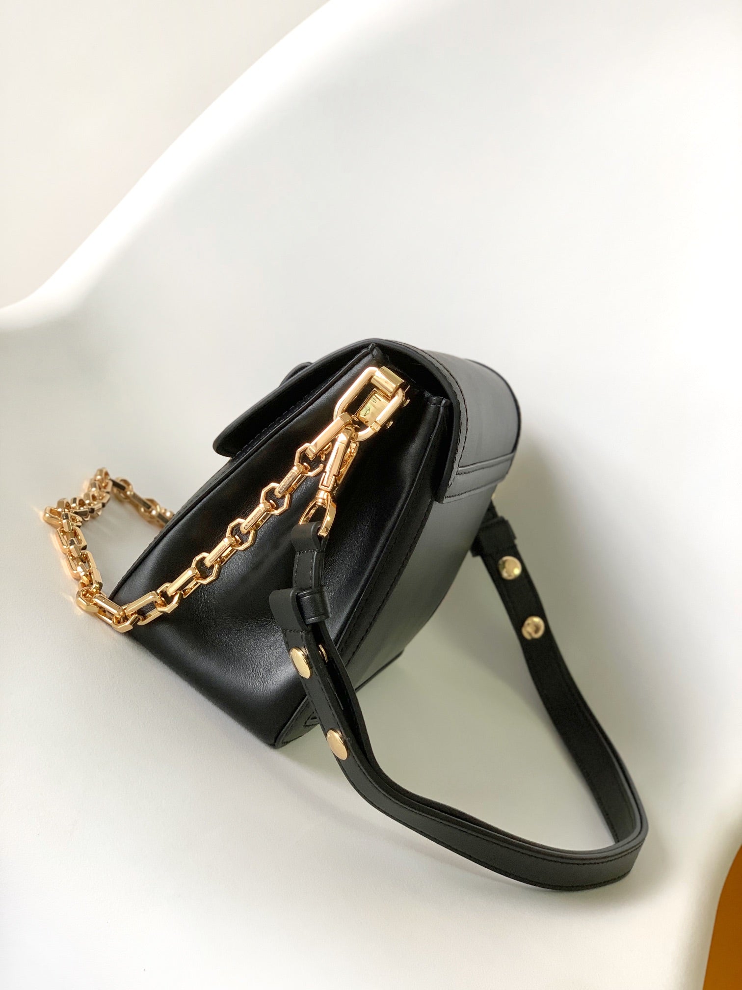 Women's Elegant Black Faux Leather Crossbody Bag with Gold Chain Detail