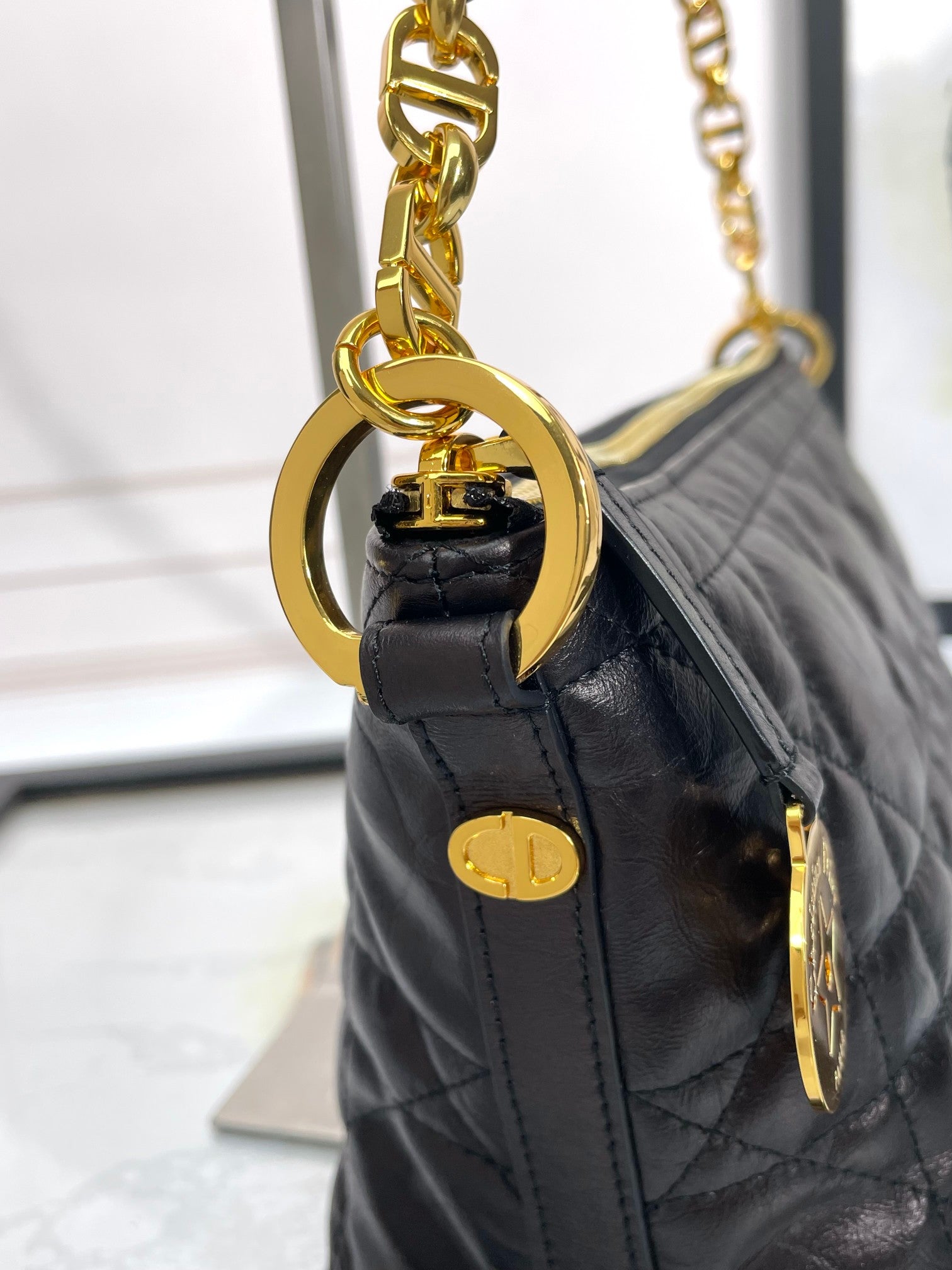 Black Quilted Leather Shoulder Bag with Gold Chain Strap