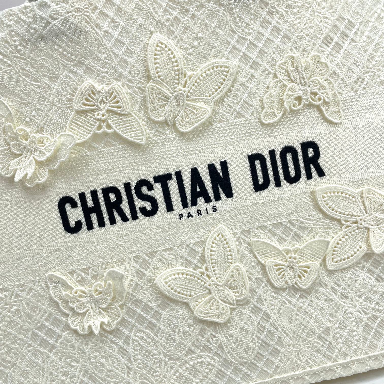 Dior Elegant Cream Canvas Handbag with 3D Textured Butterfly Appliqué