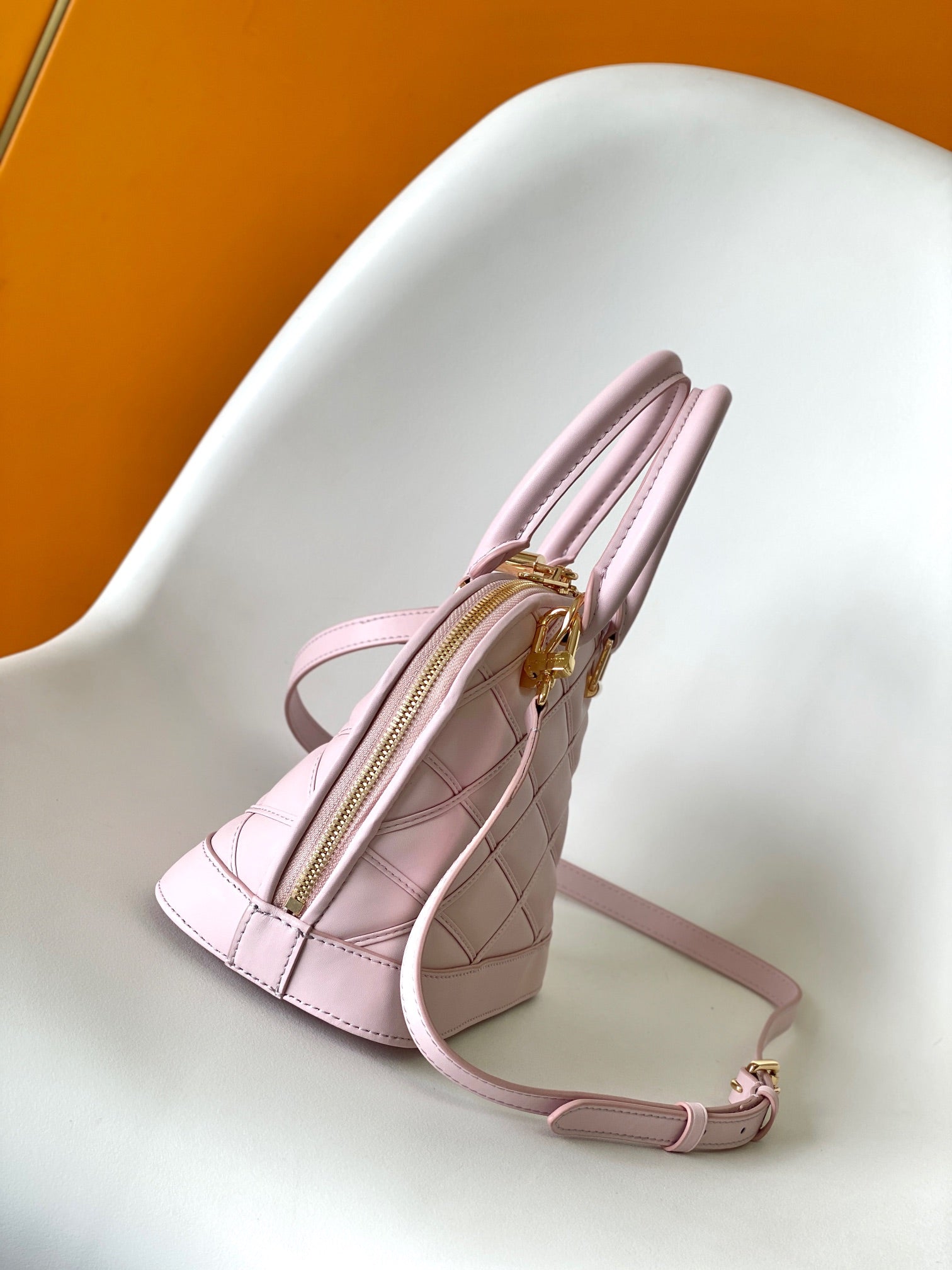 Luxury Quilted Pink Leather Dome Handbag with Gold-Tone Hardware