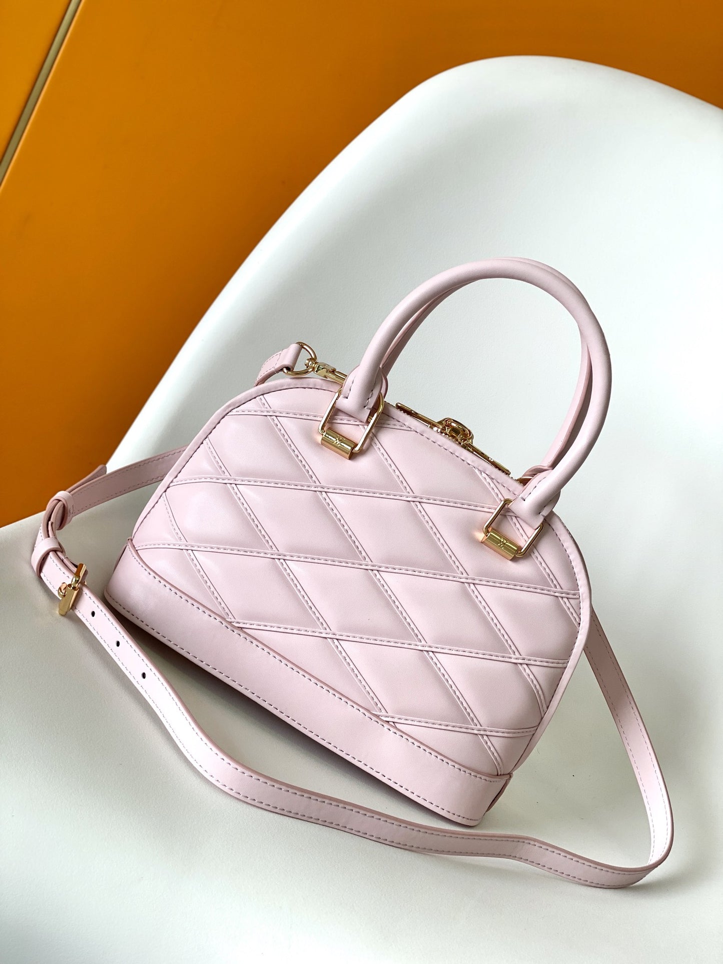 Luxury Quilted Pink Leather Dome Handbag with Gold-Tone Hardware