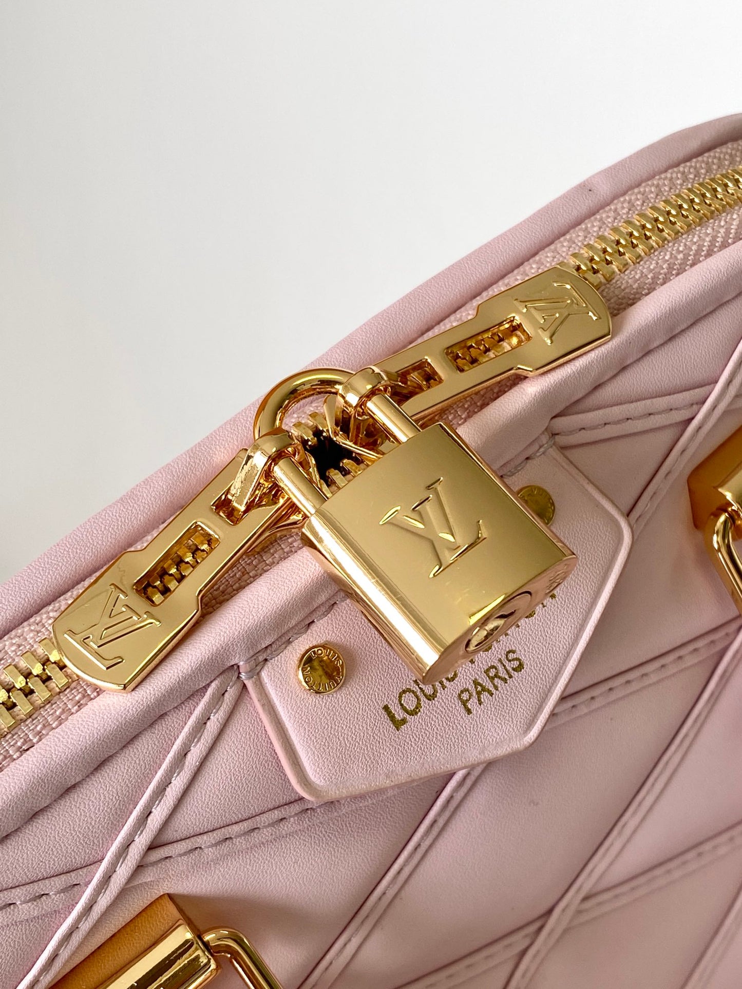 Luxury Quilted Pink Leather Dome Handbag with Gold-Tone Hardware