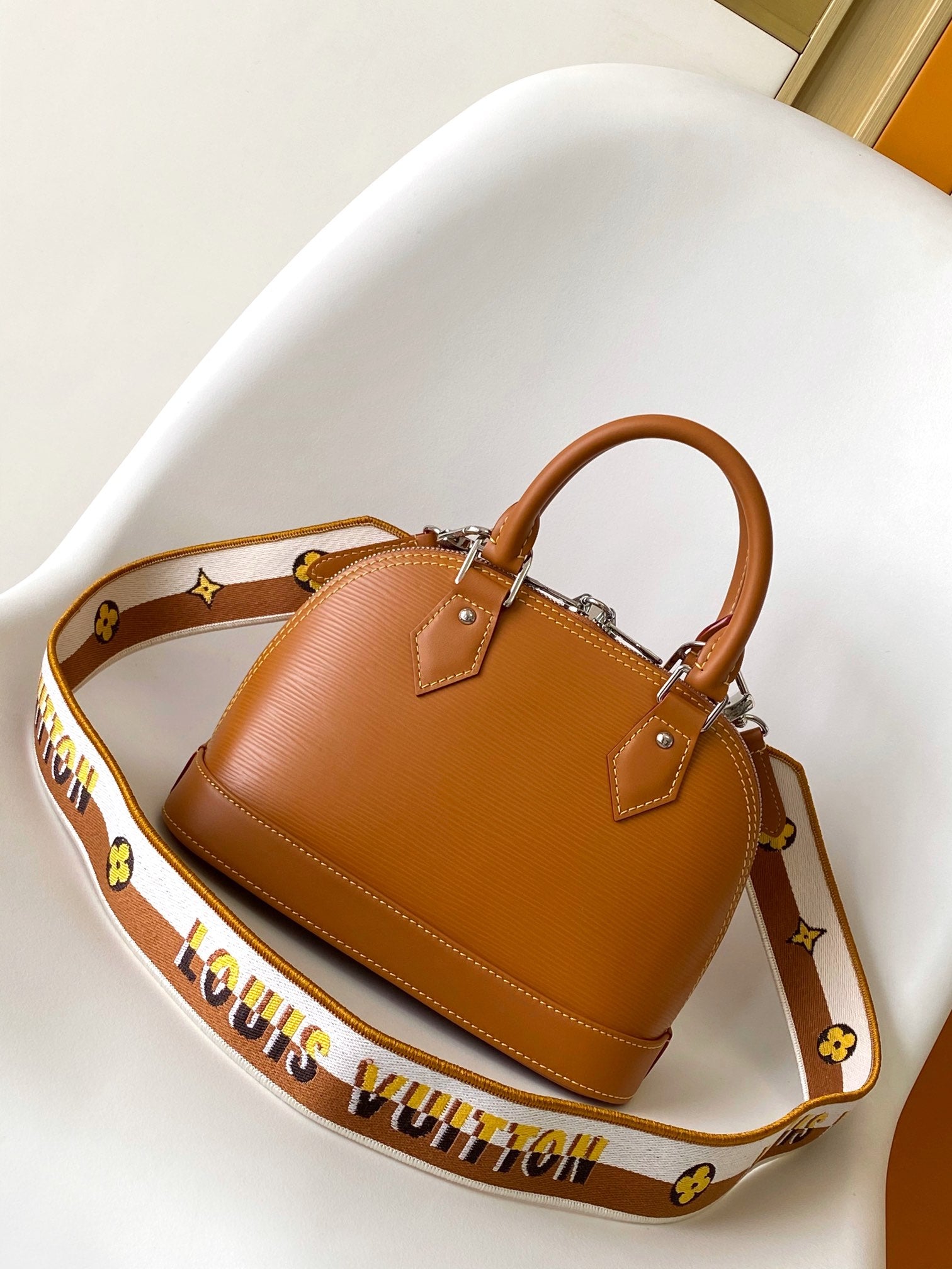 Louis Vuitton Alma BB Epi Leather Handbag with Jacquard Strap - Tan
