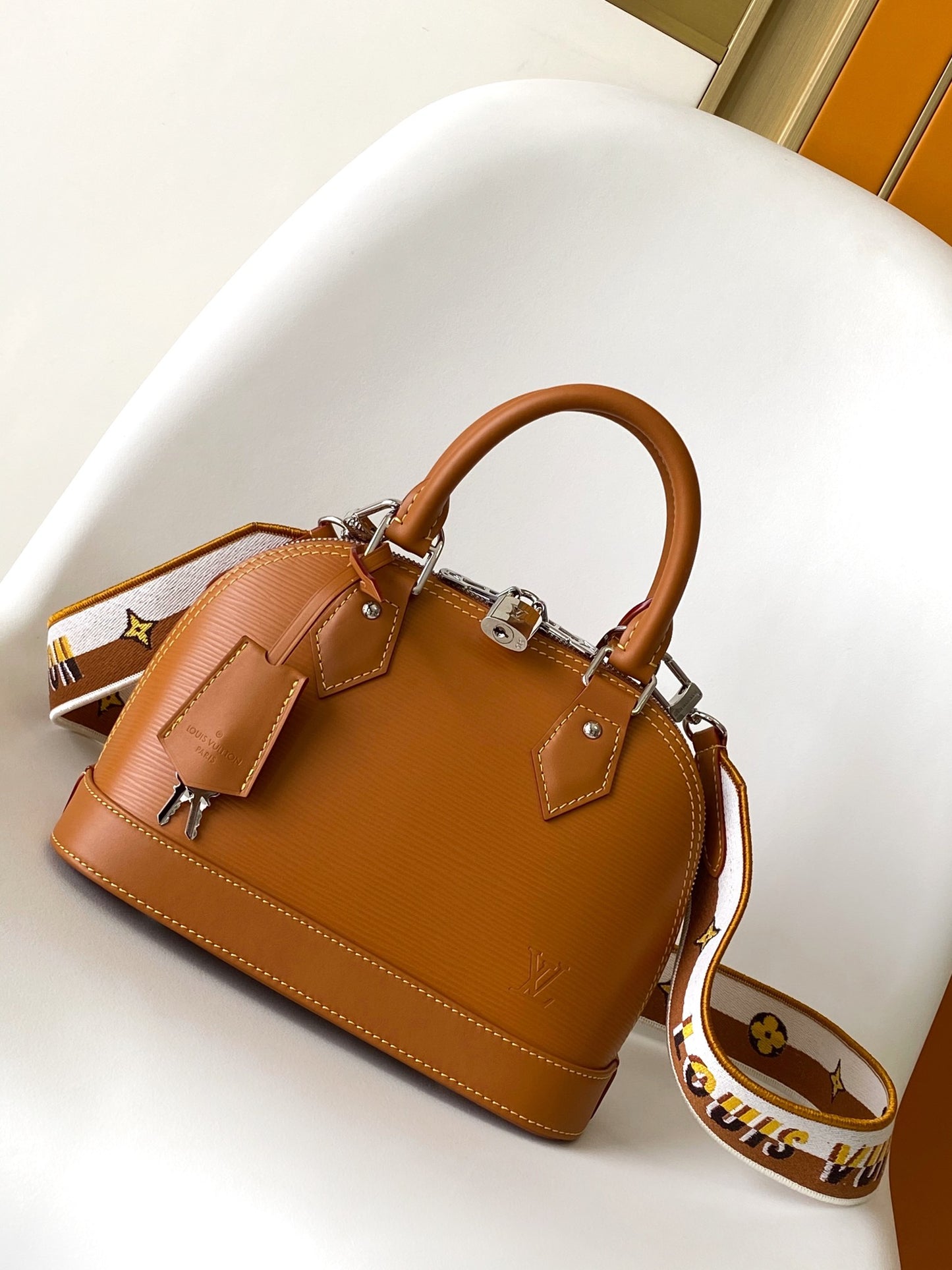 Louis Vuitton Alma BB Epi Leather Handbag with Jacquard Strap - Tan