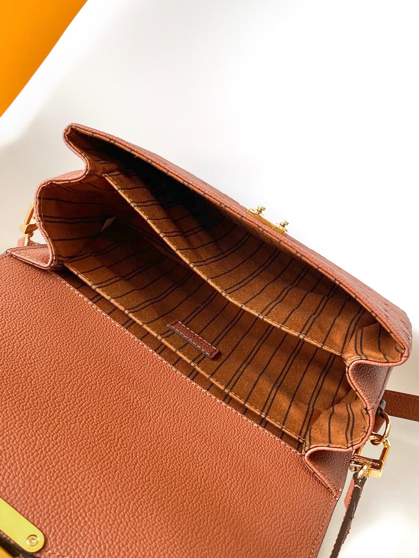 Louis Vuitton Pochette Métis Monogram Empreinte Leather Cognac Handbag