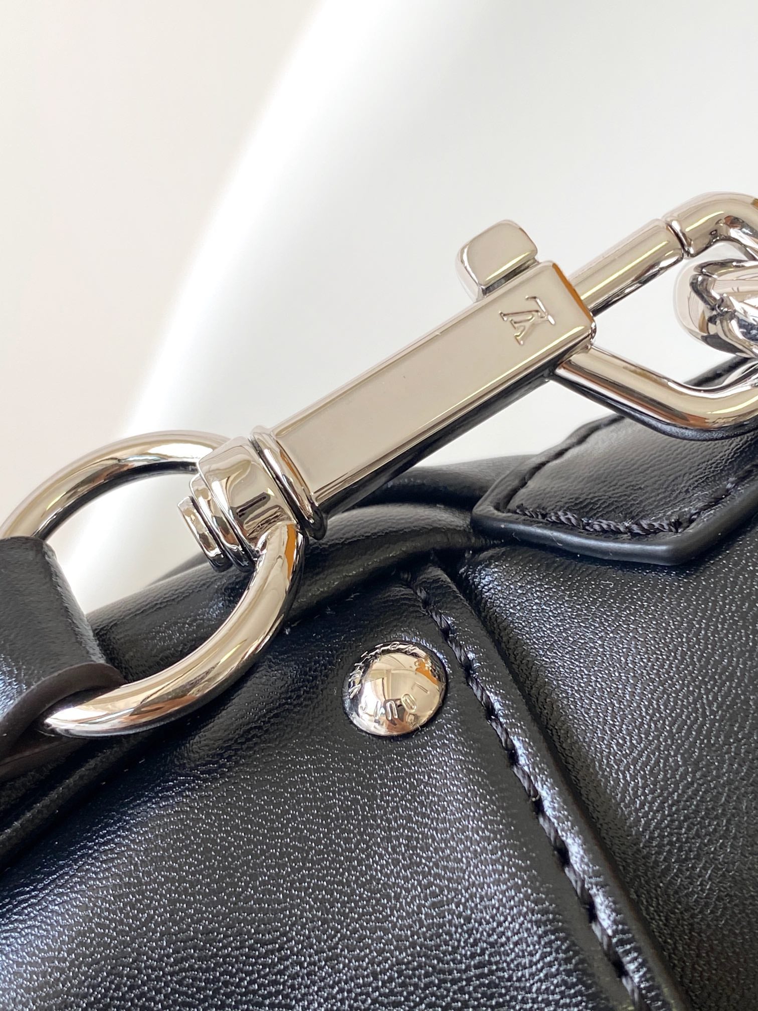 Louis Vuitton Black Leather Shoulder Bag with Monogram Buckle Detail