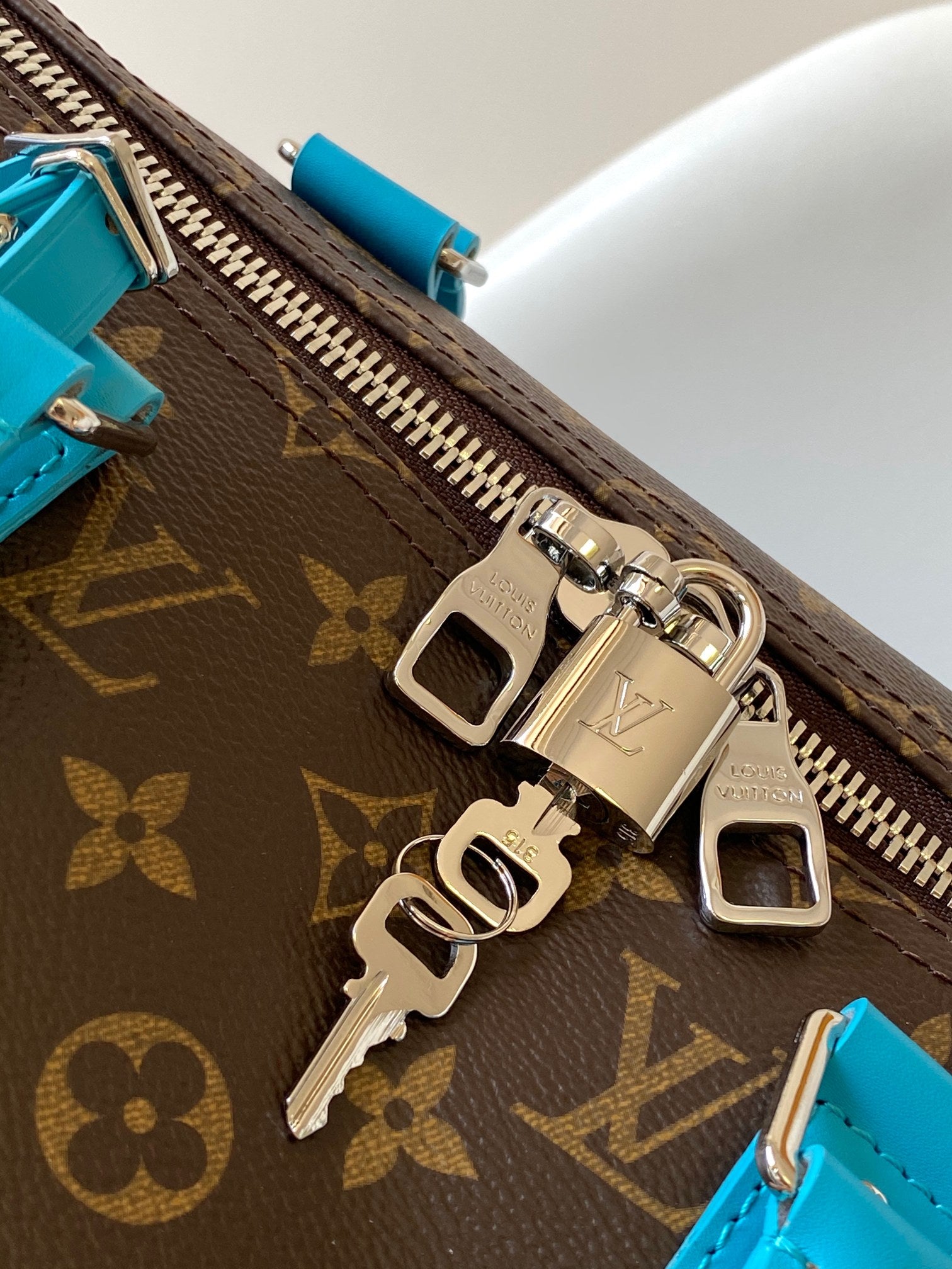 Louis Vuitton Keepall Bandoulière 50 Monogram Canvas with Turquoise Trim