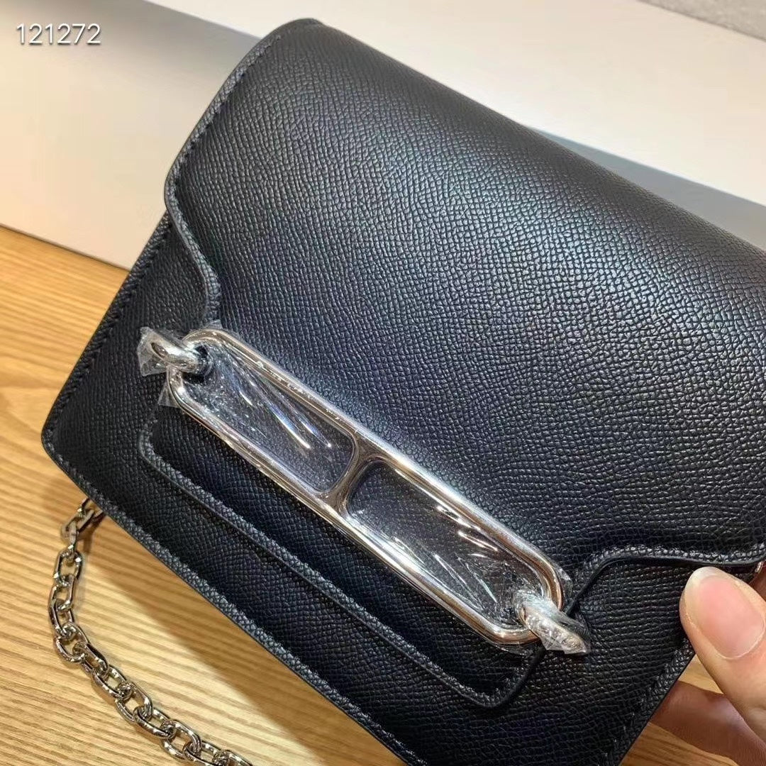 Elegant Black Shoulder Bag with Silver-Tone Chain Strap and Decorative Front Clasp