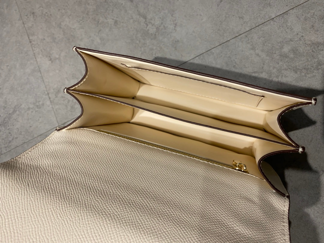 Elegant Cream Leather Crossbody Bag with Gold H Clasp