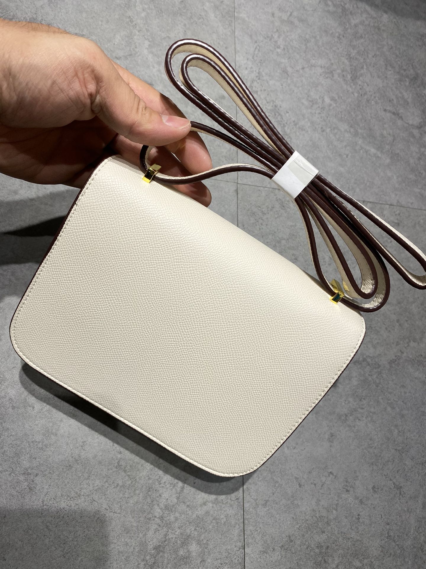 Elegant Cream Leather Crossbody Bag with Gold H Clasp
