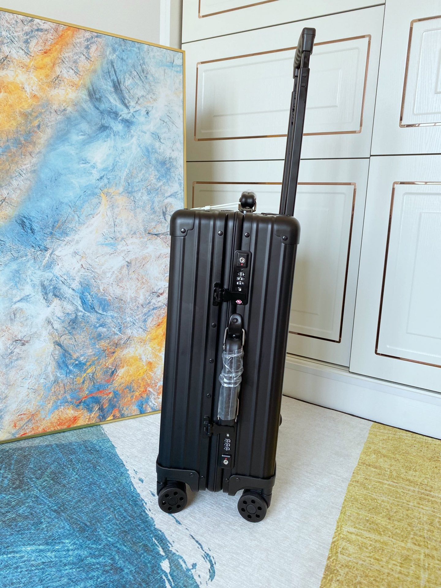 Sleek Matte Black Ribbed Carry-On Hardshell Spinner Suitcase